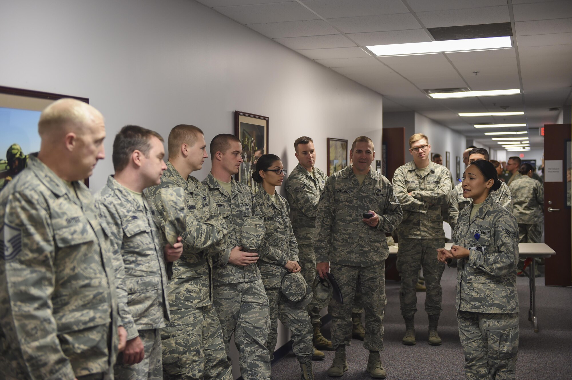 Senior Airman Adriana Saenz, 628th Medical Group (MDG) public health technician, right, briefs members of Joint Base Charleston about receiving their annual flu vaccine at a point of distribution during a public health emergency exercise on Joint Base Charleston, South Carolina, Nov. 9, 2016. The 628th MDG processed more than 1,000 patients as part of the exercise.