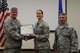 Staff Sgt. Dydra Cook, 22nd Operations Group special operations communications journeyman, poses with Col. Albert Miller, 22nd Air Refueling Wing commander, and Chief Master Sgt. Shawn Hughes, 22nd ARW command chief, Oct. 31, 2016, at McConnell Air Force Base, Kan. Staff Sgt. Cook received the spotlight performer for the week of Oct. 10-14. (U.S. Air Force photo/Staff Sgt. Rachel Waller) 