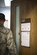 Capt. Justin Rossi, a Special Victims Counsel attorney stationed at Mountain Home Air Force Base, Idaho, enters his office at the 366th Fighter Wing Headquarters Nov. 9, 2016. The SVC provides representation and legal assistance for victims of sexual assault. (U.S. Air Force photo by 2nd Lt. Kevyn Stinett/Released)