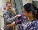 Airman 1st Class JaCoy Erickson, a medical technician with the 59th Medical Wing, checks a patients vitals at the Wilford Hall Ambulatory Surgical Center Family Health Clinic on Joint Base San Antonio-Lackland, Texas, Nov. 10, 2016. Erickson and two of his colleagues recently developed a standardization protocol that will increase patient safety and is estimated to save the wing $61,000 annually. (U.S. Air Force photo/Staff Sgt. Michael Ellis)