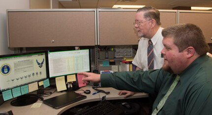 James Johnson, Air Force Personnel Center personnel research psychologist, speaks to Johnny Weissmuller, AFPC senior personnel research psychologist on Joint Base San Antonio-Randolph Nov. 9, 2016. Johnson was selected to attend the civilian acculturation leadership training program, the goal is to introduce Air Force civilians to Air Force culture and prepare them for future leadership, managerial and supervisory roles. 