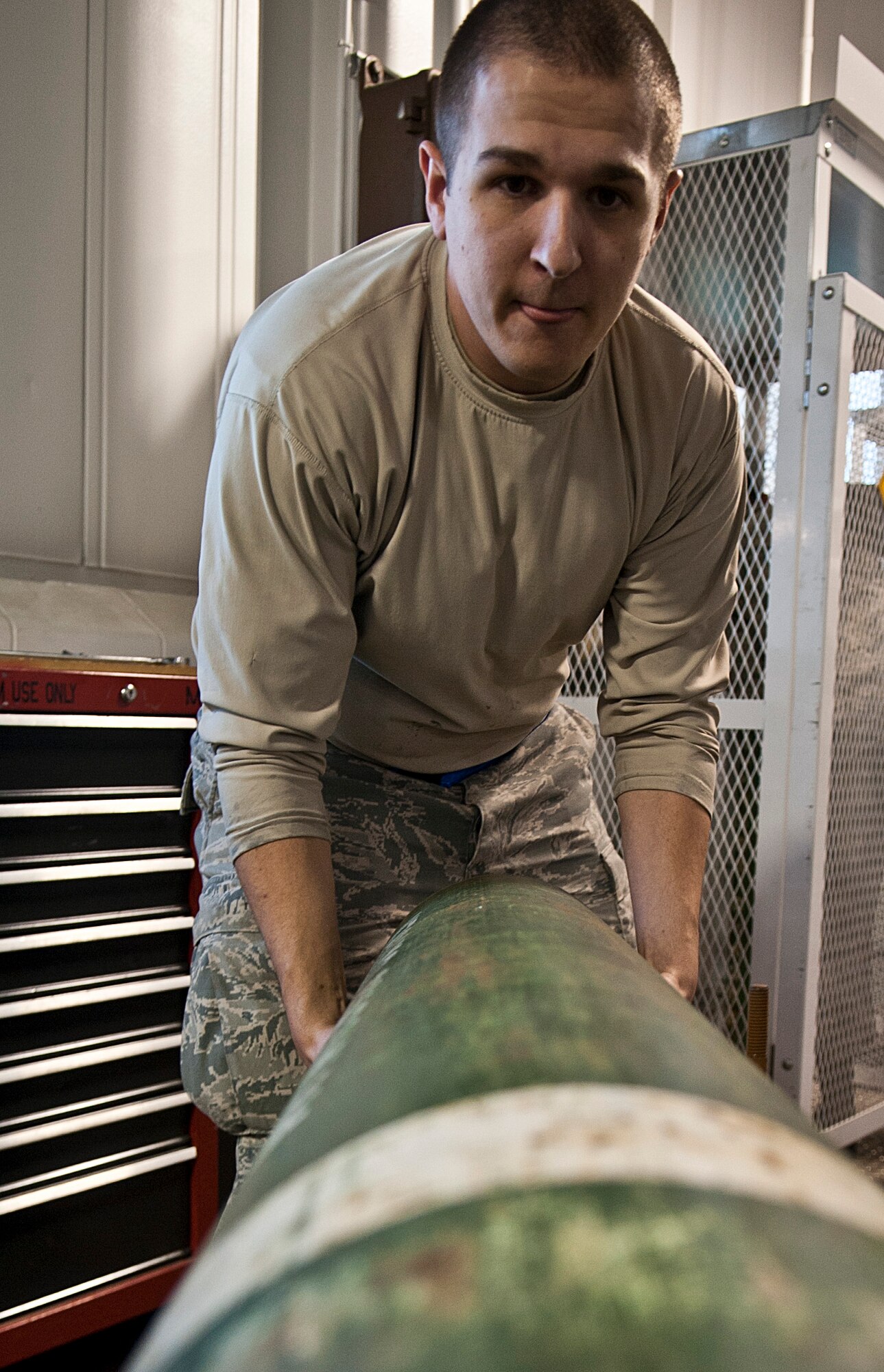Senior Airman Derrick Pierce, 5th Maintenance Squadron electrical and environmental journeyman, removes a depleted gaseous oxygen bottle from a cart at Minot Air Force Base, N.D., Nov. 7, 2016. Electrical and environmental Airmen are responsible for managing all oxygen bottles used for hot gas purges on the B-52H Stratofortress’ liquid oxygen system. (U.S. Air Force photo/Airman 1st Class Jonathan McElderry)