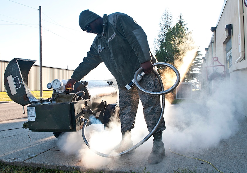 Staff Sgt. Rashad Dallas, 5th Maintenance Squadron electrical and environmental craftsman, checks a liquid oxygen cart at Minot Air Force Base, N.D., Nov. 2, 2016. Electrical and environmental Airmen perform daily inspections on all liquid oxygen carts used for supplying oxygen to aircrews. (U.S. Air Force photo/Airman 1st Class Jonathan McElderry)