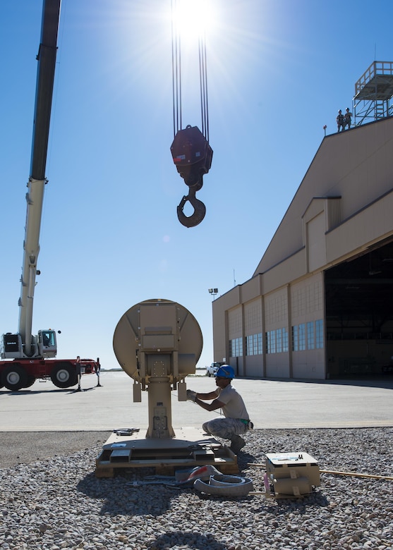 Senior Airman Jon, a 49th Aircraft Maintenance Squadron aircraft communications maintenance technician, prepares a Ground Data Terminal antenna for installation at Holloman Air Force Base, N.M., on Nov. 8, 2016. Installation of the GDT significantly contributes to the amount of Remotely Piloted Aircraft missions that can be flown each day by allowing all Ground Control Stations to be utilized. (U.S. Air Force photo by Senior Airman Emily Kenney)