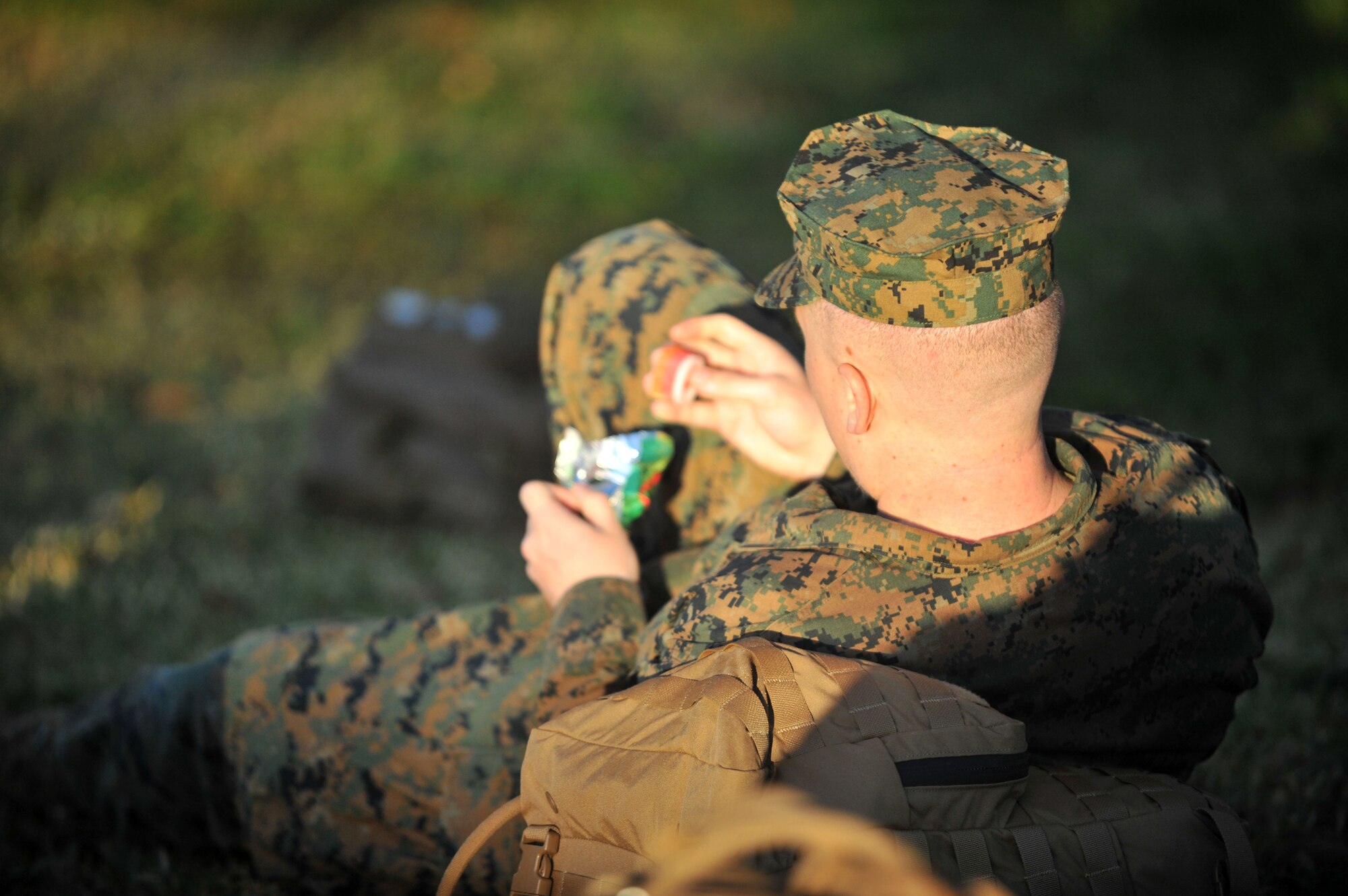 A Marine assigned to the U.S. Marine Corps Forces Central Command sits down to eat a snack during a break from the 12-mile march at MacDill Air Force Base Fla., Nov. 2016. Marines were allowed a 10-minute break every 50 minutes to rest before the next part of the march. (U.S. Air Force Photo by Airman 1st Class Rito Smith)