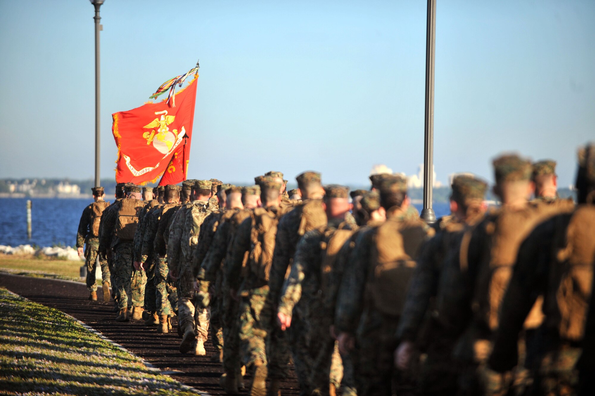 Marines assigned to the U.S. Marine Corps Forces Central Command march down Bayshore during their 12-mile hike on the 241st birthday of the Marine Corps at MacDill Air Force Base, Fla., Nov. 10, 2016. Leaders in the group carried the Marine Corps flag during the entire 12-mile hike. (U.S. Air Force Photo by Airman 1st Class Rito Smith)