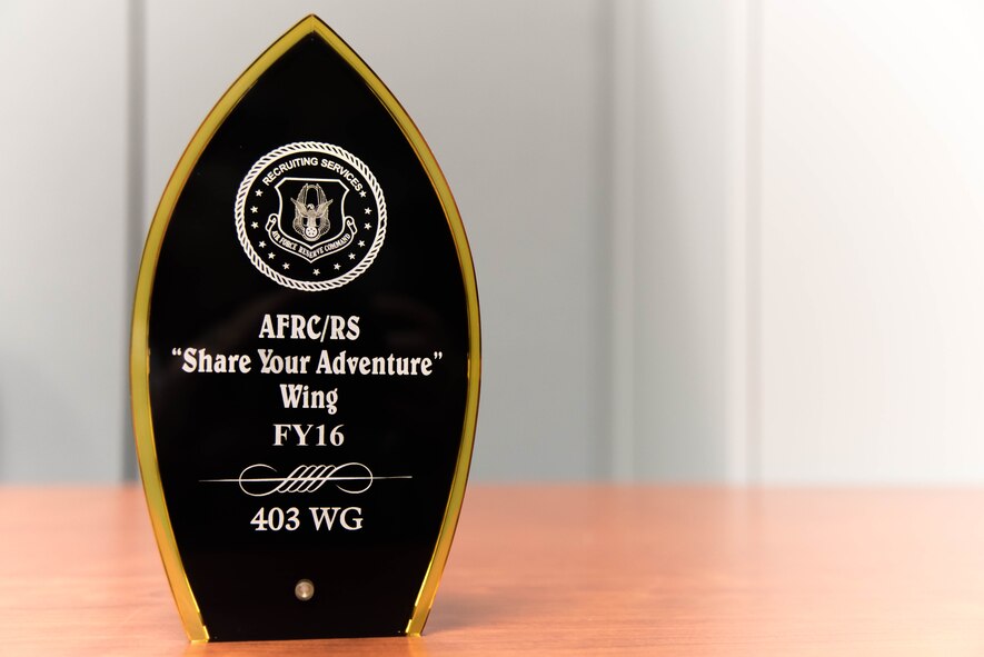 The 403rd Wing Recruiting Office won the Air Force Reserve Command Recruiting Service's Share Your Adventure Award Oct. 27. This award was presented for having the most ascessions through the Get 1 Now program. (U.S. Air Force photo/Staff Sgt. Heather Heiney) 