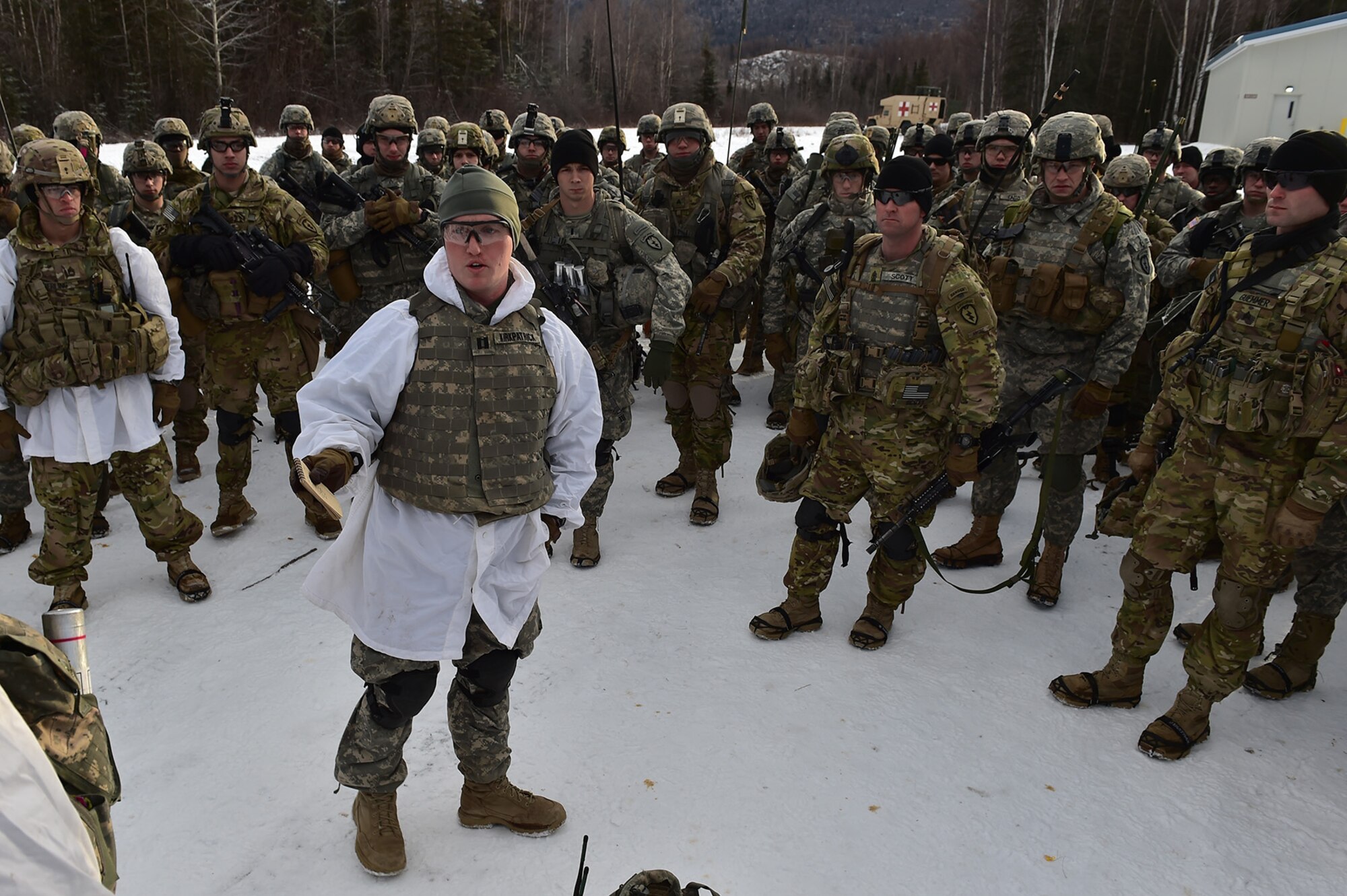 Army Capt. Grant Kirkpatrick gives a safety briefing to paratroopers assigned to Baker Company, 3rd Battalion, 509th Parachute Infantry Regiment, 4th Infantry Brigade Combat Team (Airborne), 25th Infantry Division, U.S. Army Alaska, before they conduct live-fire and movement-to-contact operations on the Infantry Squad Battle Course at Joint Base Elmendorf-Richardson, Alaska, Nov. 8, 2016. The soldiers focused on core infantry skills such as fire team movement, communication, shifting fire, and once on the objective identifying and eliminating weapons caches and treating and evacuating casualties. 