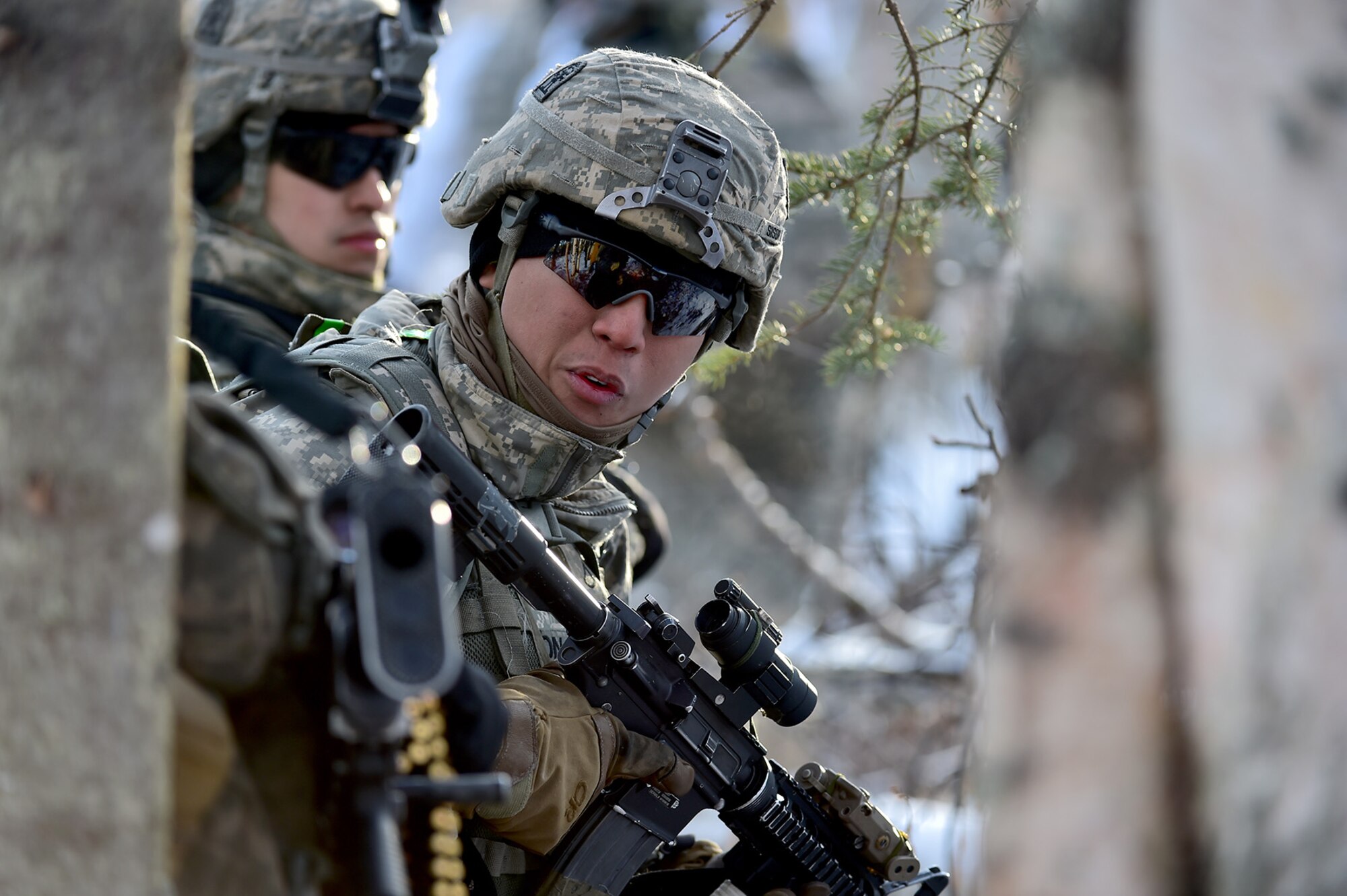 Army Pfc. Chrisalexander Sison, assigned to Baker Company, 3rd Battalion, 509th Parachute Infantry Regiment, 4th Infantry Brigade Combat Team (Airborne), 25th Infantry Division, U.S. Army Alaska, waits for the order to advance during live-fire and movement-to-contact operations on the Infantry Squad Battle Course at Joint Base Elmendorf-Richardson, Alaska, Nov. 8, 2016. The soldiers focused on core infantry skills such as fire team movement, communication, shifting fire, and once on the objective identifying and eliminating weapons caches and treating and evacuating casualties.  