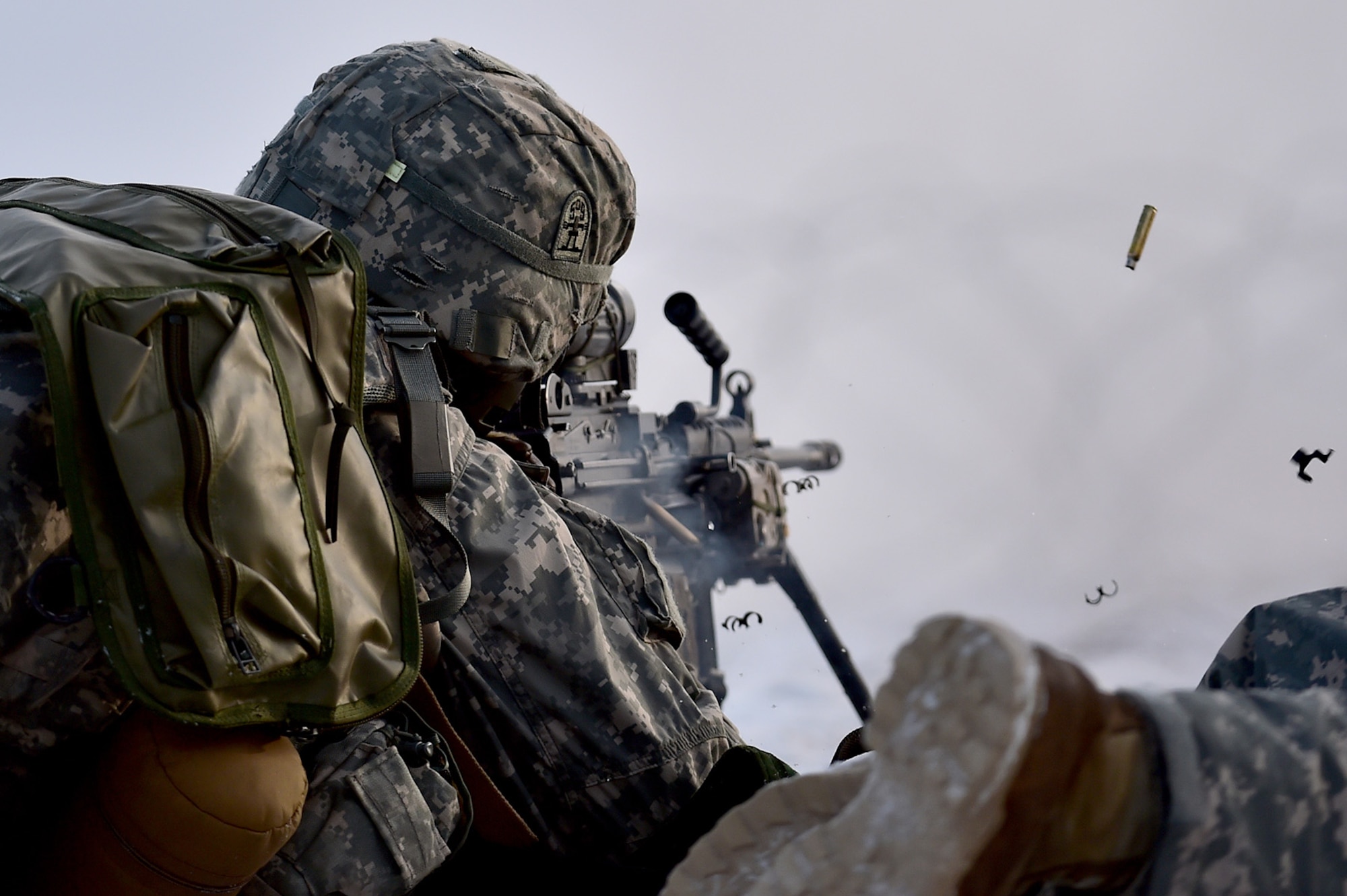 An automatic rifleman, assigned to Baker Company, 3rd Battalion, 509th Parachute Infantry Regiment, 4th Infantry Brigade Combat Team (Airborne), 25th Infantry Division, U.S. Army Alaska, lays suppressive fire while conducting live-fire and movement-to-contact operations on the Infantry Squad Battle Course at Joint Base Elmendorf-Richardson, Alaska, Nov. 8, 2016. The soldiers focused on core infantry skills such as fire team movement, communication, shifting fire, and once on the objective identifying and eliminating weapons caches and treating and evacuating casualties.  