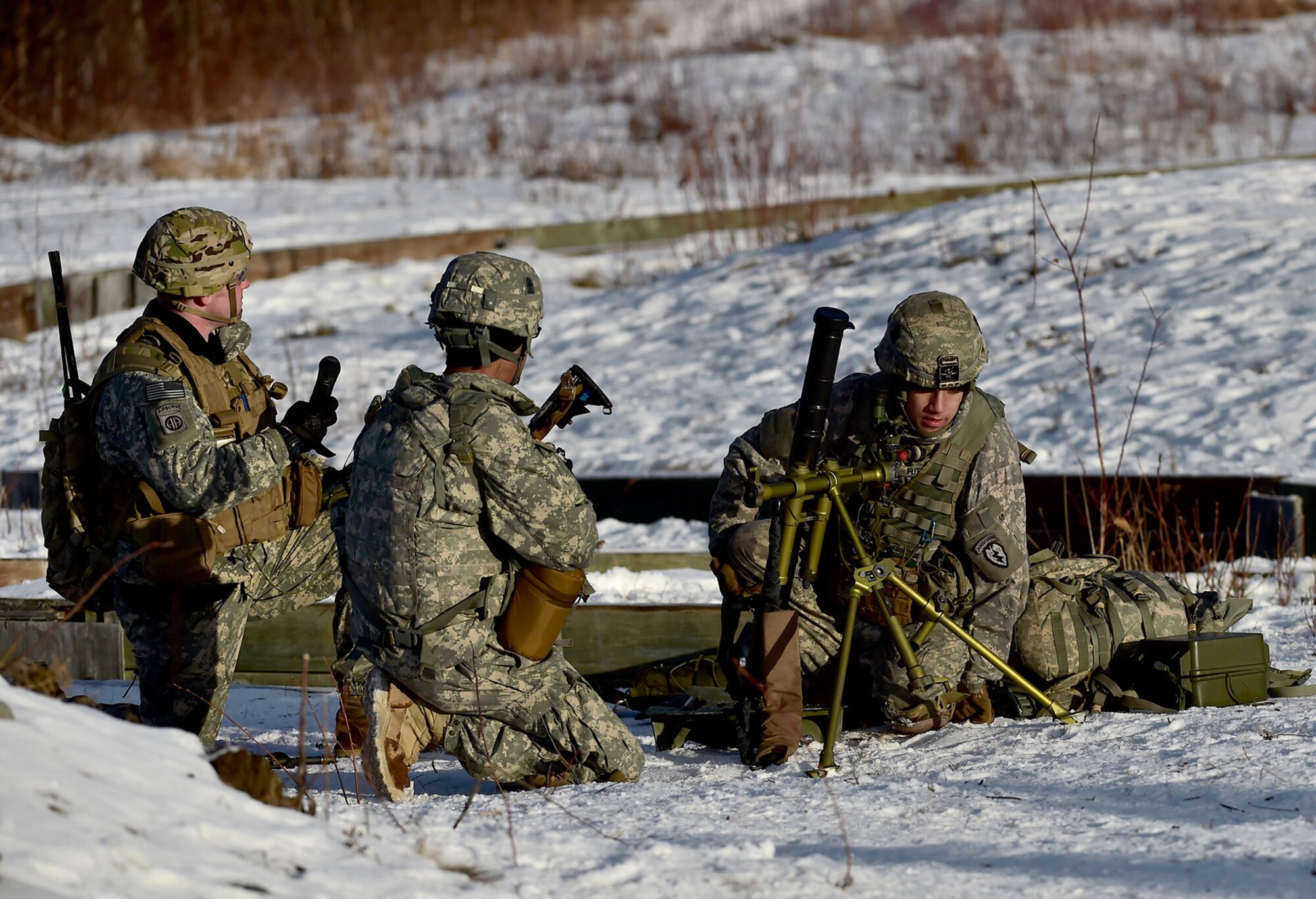 Army Pvt. Tyler Futrell, right, assigned to Baker Company, 3rd Battalion, 509th Parachute Infantry Regiment, 4th Infantry Brigade Combat Team (Airborne), 25th Infantry Division, U.S. Army Alaska, waits for the order rally with fellow mortarmen after live-fire and movement-to-contact operations ended on the Infantry Squad Battle Course at Joint Base Elmendorf-Richardson, Alaska, Nov. 8, 2016. The soldiers focused on core infantry skills such as fire team movement, communication, shifting fire, and once on the objective identifying and eliminating weapons caches and treating and evacuating casualties. 