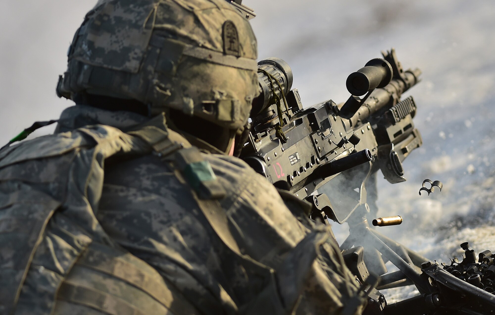 A machine gunner assigned to Baker Company, 3rd Battalion, 509th Parachute Infantry Regiment, 4th Infantry Brigade Combat Team (Airborne), 25th Infantry Division, U.S. Army Alaska, lays suppressive fire during live-fire and movement-to-contact operations on the Infantry Squad Battle Course at Joint Base Elmendorf-Richardson, Alaska, Nov. 8, 2016. The soldiers focused on core infantry skills such as fire team movement, communication, shifting fire, and once on the objective identifying and eliminating weapons caches and treating and evacuating casualties.  