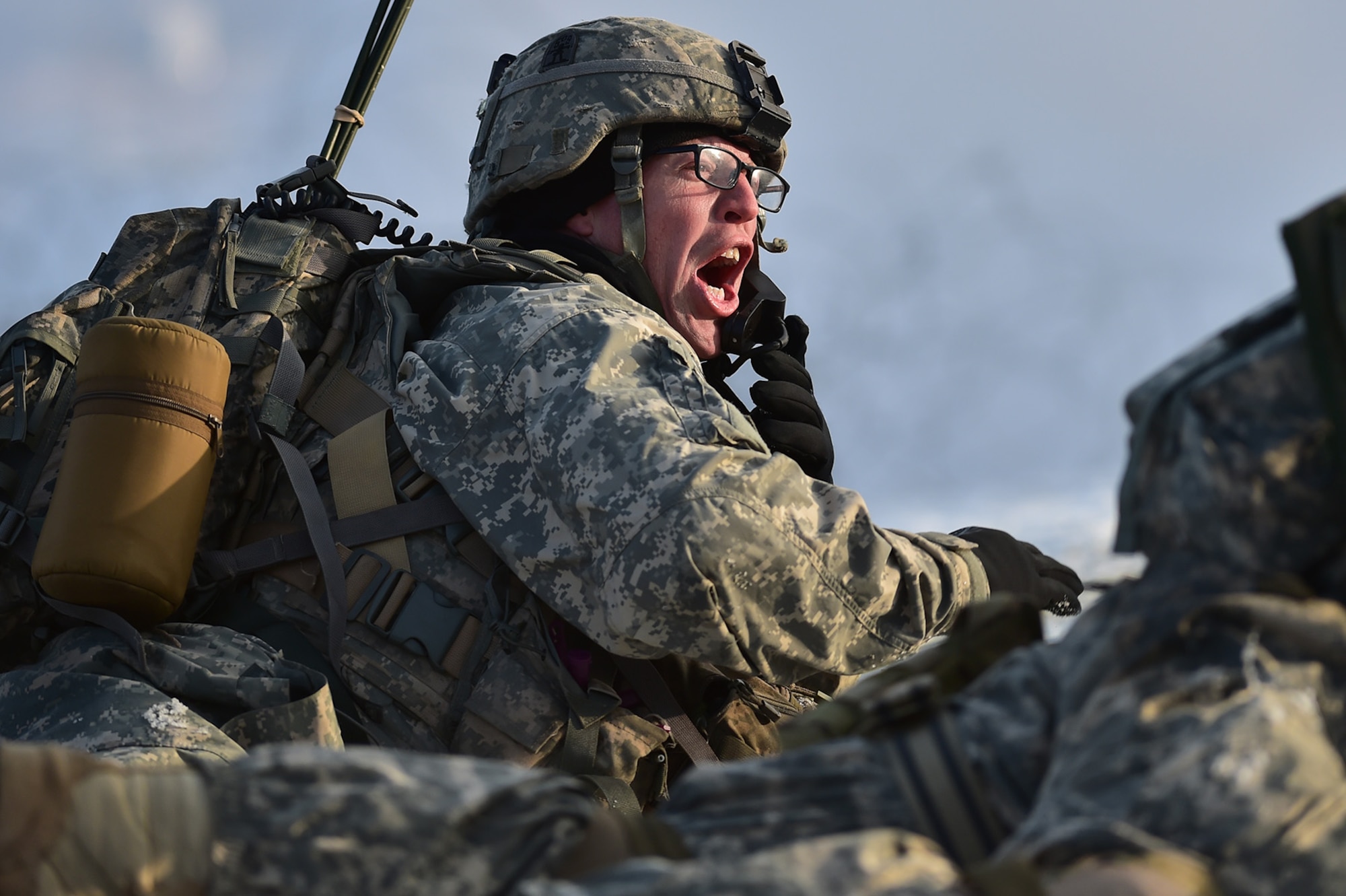 Army Staff Sgt. Samuel Hammer, assigned to Baker Company, 3rd Battalion, 509th Parachute Infantry Regiment, 4th Infantry Brigade Combat Team (Airborne), 25th Infantry Division, U.S. Army Alaska, screams orders to his squad during live-fire and movement-to-contact operations on the Infantry Squad Battle Course at Joint Base Elmendorf-Richardson, Alaska, Nov. 8, 2016. The soldiers focused on core infantry skills such as fire team movement, communication, shifting fire, and once on the objective identifying and eliminating weapons caches and treating and evacuating casualties.  