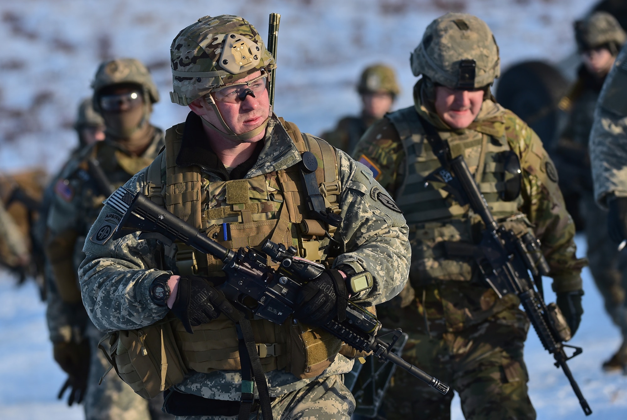 Paratroopers assigned to Baker Company, 3rd Battalion, 509th Parachute Infantry Regiment, 4th Infantry Brigade Combat Team (Airborne), 25th Infantry Division, U.S. Army Alaska, make their way to a rally point after live-fire and movement-to-contact operations on the Infantry Squad Battle Course at Joint Base Elmendorf-Richardson, Alaska, Nov. 8, 2016. The soldiers focused on core infantry skills such as fire team movement, communication, shifting fire, and once on the objective identifying and eliminating weapons caches and treating and evacuating casualties.  