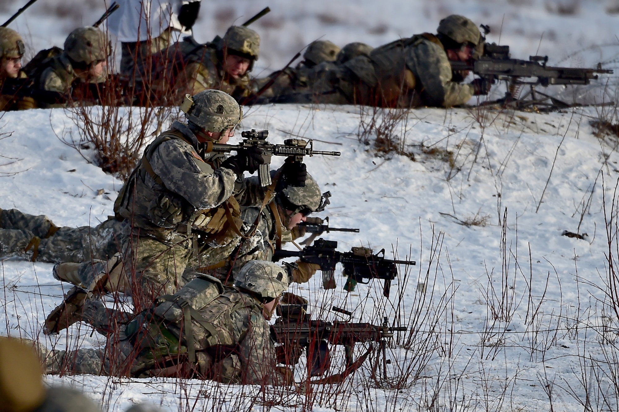 Paratroopers assigned to Baker Company, 3rd Battalion, 509th Parachute Infantry Regiment, 4th Infantry Brigade Combat Team (Airborne), 25th Infantry Division, U.S. Army Alaska, conduct live-fire and movement-to-contact operations on the Infantry Squad Battle Course at Joint Base Elmendorf-Richardson, Alaska, Nov. 8, 2016. The soldiers focused on core infantry skills such as fire team movement, communication, shifting fire, and once on the objective identifying and eliminating weapons caches and treating and evacuating casualties. 