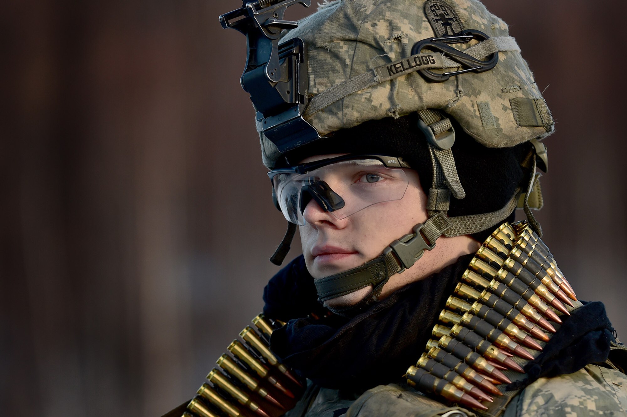 Spc. Scott Kellogg, assigned to Baker Company, 3rd Battalion, 509th Parachute Infantry Regiment, 4th Infantry Brigade Combat Team (Airborne), 25th Infantry Division, U.S. Army Alaska, listens to a fellow paratrooper after live-fire and movement-to-contact operations on the Infantry Squad Battle Course at Joint Base Elmendorf-Richardson, Alaska, Nov. 8, 2016. The soldiers focused on core infantry skills such as fire team movement, communication, shifting fire, and once on the objective identifying and eliminating weapons caches and treating and evacuating casualties. 