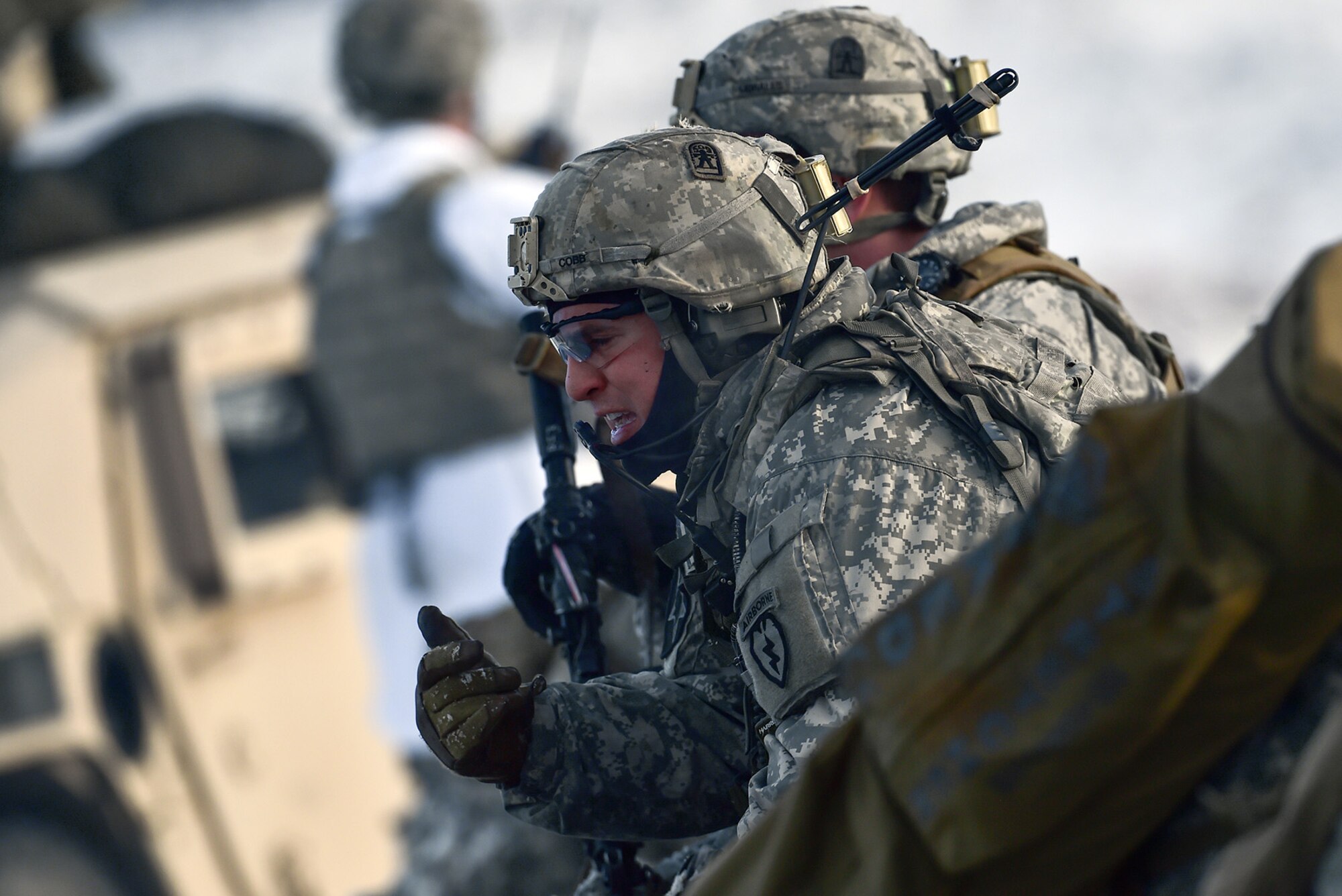 Army Sgt. Christopher Cobb, assigned to Baker Company, 3rd Battalion, 509th Parachute Infantry Regiment, 4th Infantry Brigade Combat Team (Airborne), 25th Infantry Division, U.S. Army Alaska, yells orders to his Soldiers during live-fire and movement-to-contact operations on the Infantry Squad Battle Course at Joint Base Elmendorf-Richardson, Alaska, Nov. 8, 2016. The soldiers focused on core infantry skills such as fire team movement, communication, shifting fire, and once on the objective identifying and eliminating weapons caches and treating and evacuating casualties.  (U.S. Air Force photo/Justin Connaher)