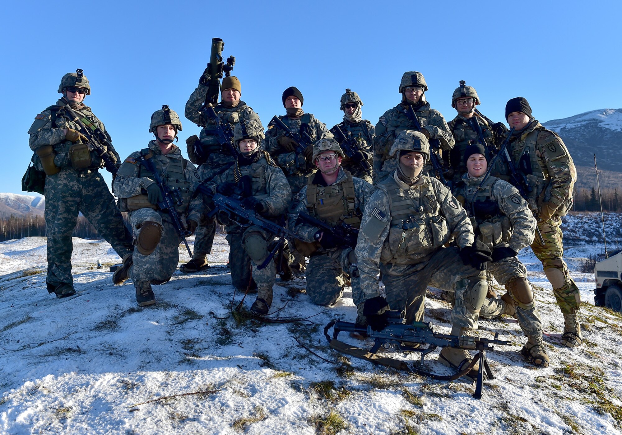 Paratroopers assigned to Baker Company, 3rd Battalion, 509th Parachute Infantry Regiment, 4th Infantry Brigade Combat Team (Airborne), 25th Infantry Division, U.S. Army Alaska, pose for a photo after conducting live-fire and movement-to-contact operations on the Infantry Squad Battle Course at Joint Base Elmendorf-Richardson, Alaska, Nov. 8, 2016. The soldiers focused on core infantry skills such as fire team movement, communication, shifting fire, and once on the objective identifying and eliminating weapons caches and treating and evacuating casualties.  (U.S. Air Force photo/Justin Connaher)