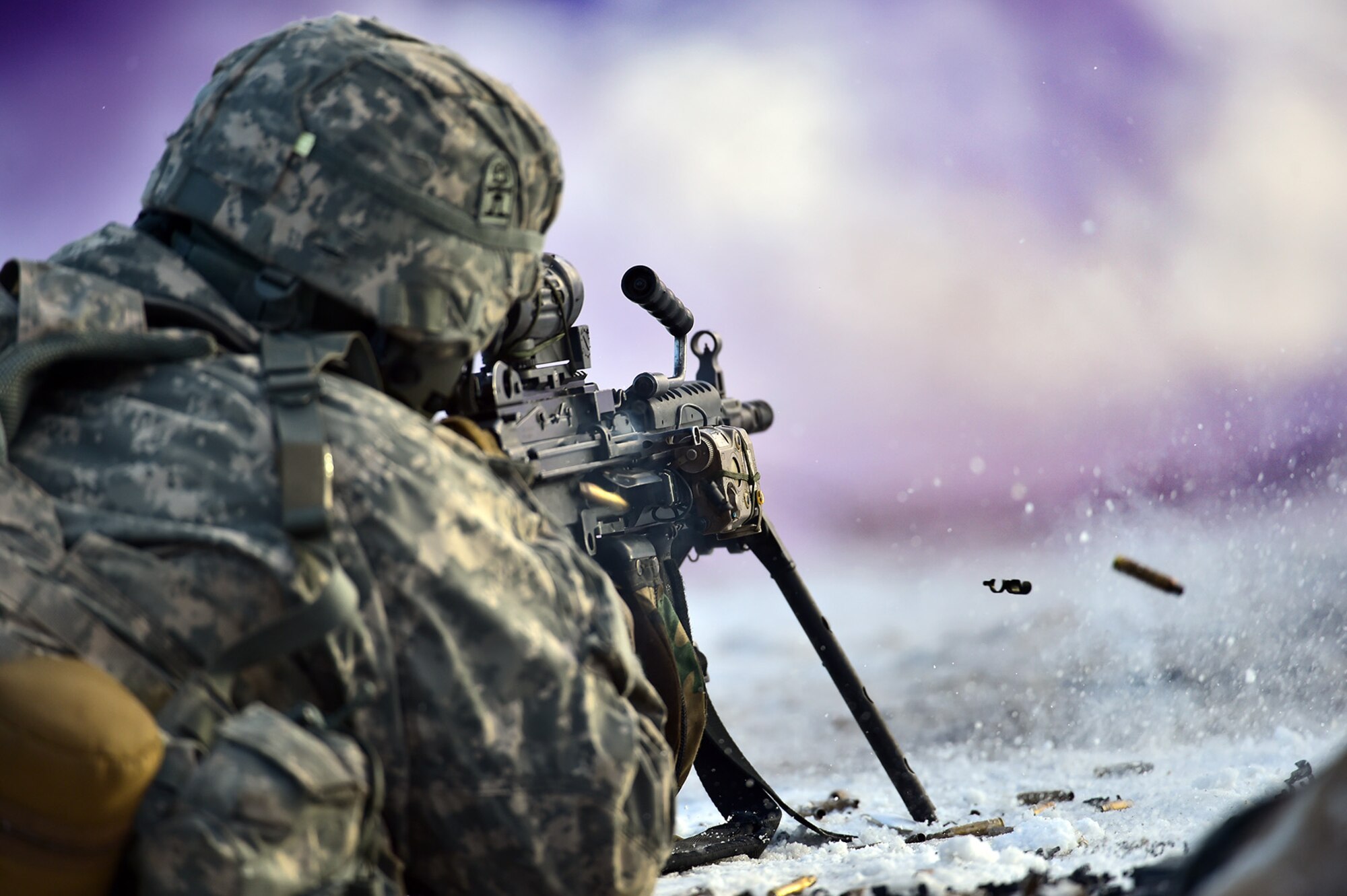 An automatic rifleman assigned to Baker Company, 3rd Battalion, 509th Parachute Infantry Regiment, 4th Infantry Brigade Combat Team (Airborne), 25th Infantry Division, U.S. Army Alaska, conduct live-fire and movement-to-contact operations on the Infantry Squad Battle Course at Joint Base Elmendorf-Richardson, Alaska, Nov. 8, 2016. The soldiers focused on core infantry skills such as fire team movement, communication, shifting fire, and once on the objective identifying and eliminating weapons caches and treating and evacuating casualties.  (U.S. Air Force photo/Justin Connaher)
