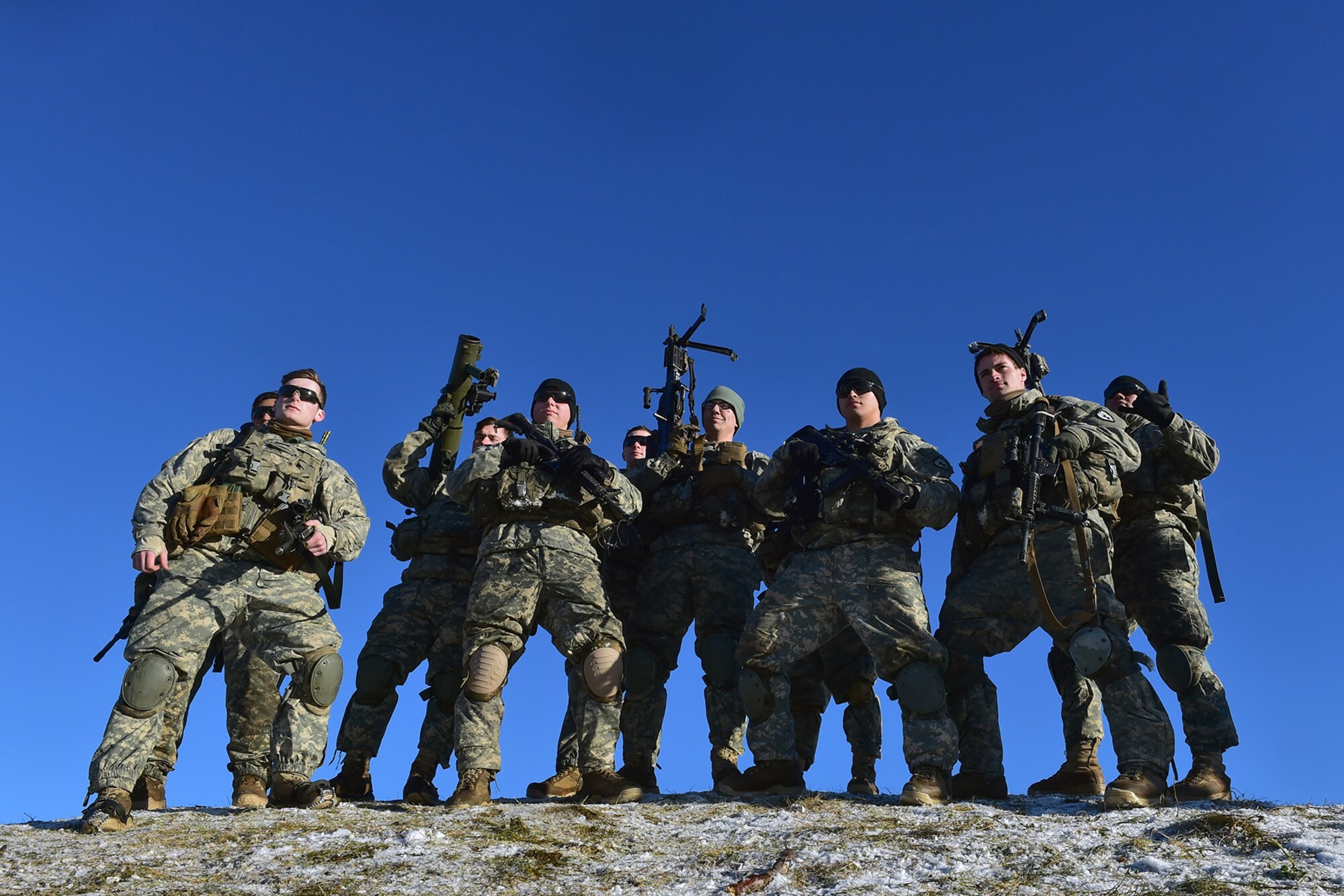 Paratroopers assigned to Baker Company, 3rd Battalion, 509th Parachute Infantry Regiment, 4th Infantry Brigade Combat Team (Airborne), 25th Infantry Division, U.S. Army Alaska, pose for a photo after conducting live-fire and movement-to-contact operations on the Infantry Squad Battle Course at Joint Base Elmendorf-Richardson, Alaska, Nov. 8, 2016. The soldiers focused on core infantry skills such as fire team movement, communication, shifting fire, and once on the objective identifying and eliminating weapons caches and treating and evacuating casualties. 