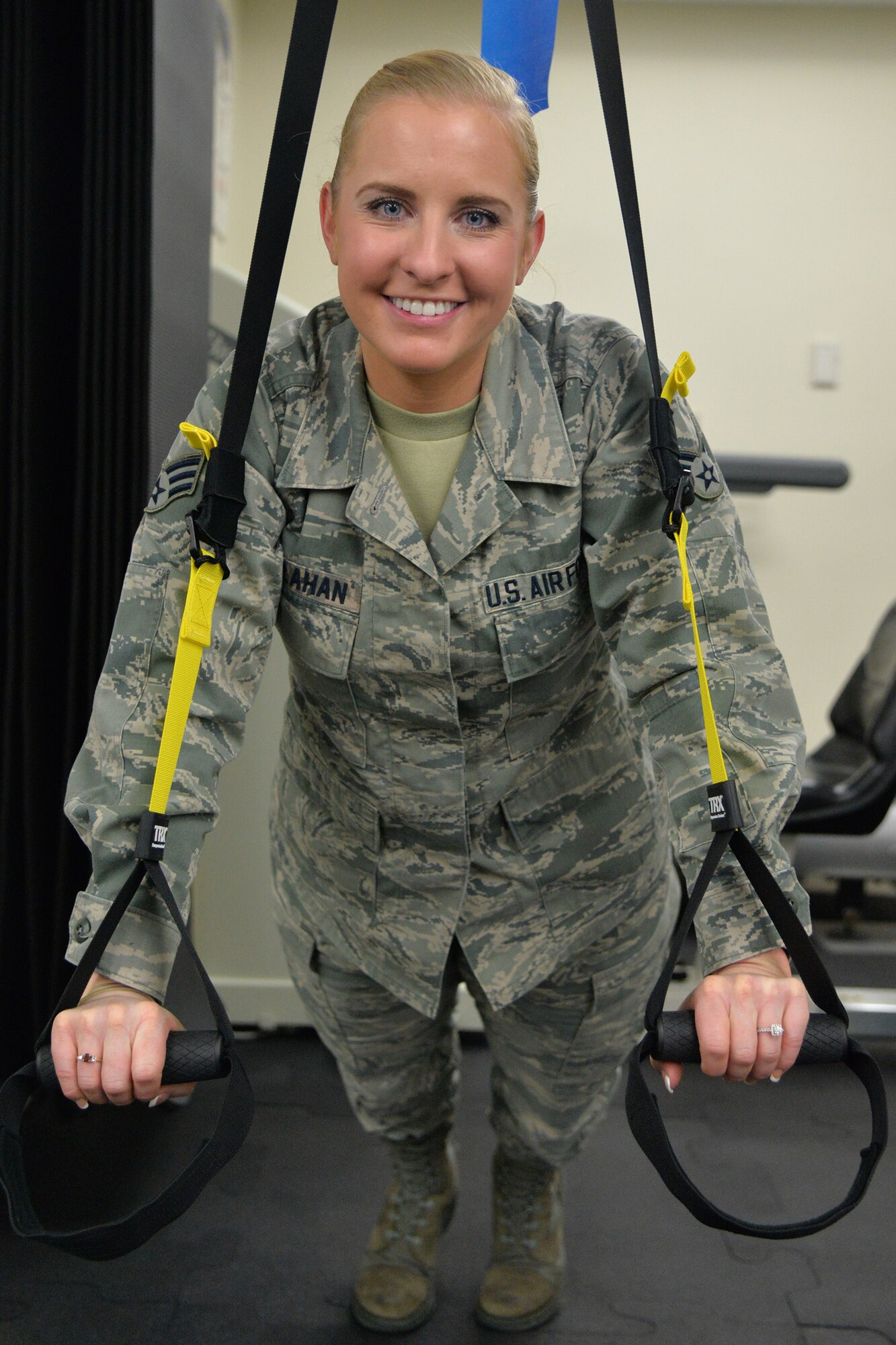 Senior Airman Kaitlyn Callahan, 341st Medical Operations Squadron physical therapy technician, poses for a photo Nov. 9, 2016, at Malmstrom Air Force Base, Mont. Callahan is responsible for assisting Airmen in rehabilitation who have been injured. She also helps prevent Airmen from causing further injuries by educating them on proper exercise form. (U.S. Air Force photo/Airman 1st Class Daniel Brosam)