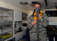 Senior Airman Ashley Cox, 92nd Medical Operations Squadron emergency medical technician, demonstrates how to use an oxygen mask, Aug. 18, 2016, at Fairchild Air Force Base, Wash. Fairchild ambulances are capable of transporting up to four casualties at one time. (U.S. Air Force photo/Senior Airman Samuel Fogleman)