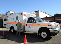 Senior Airman Ashley Cox, 92nd Medical Operations Squadron emergency medical technician, stands beside one of the two base clinic ambulances, Aug. 18, 2016, at Fairchild Air Force Base, Wash. EMTs assist clinic staff during the day and operate alongside firefighters at night. (U.S. Air Force photo/Senior Airman Samuel Fogleman)