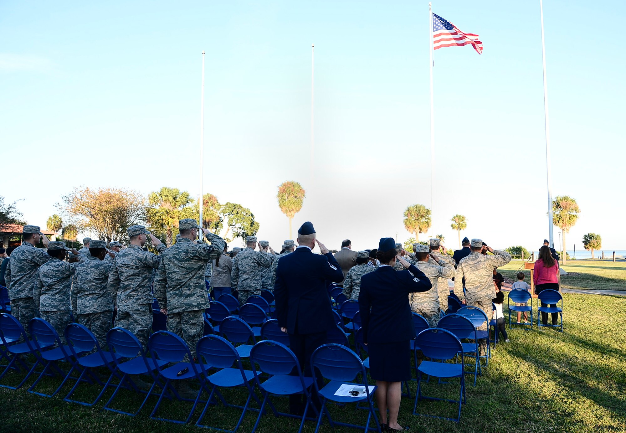 Members from MacDill Air Force Base, Fla., salute the American Flag during the National Anthem at a Veterans Day ceremony Nov. 10, 2016. MacDill honored Veterans Day with a ceremony consisting of opening remarks by Col. Patrick Miller, commander of the 6th Mission Support Group, a flag fold and retreat ceremony. (U.S. Air Force photo by Senior Airman Tori Schultz)