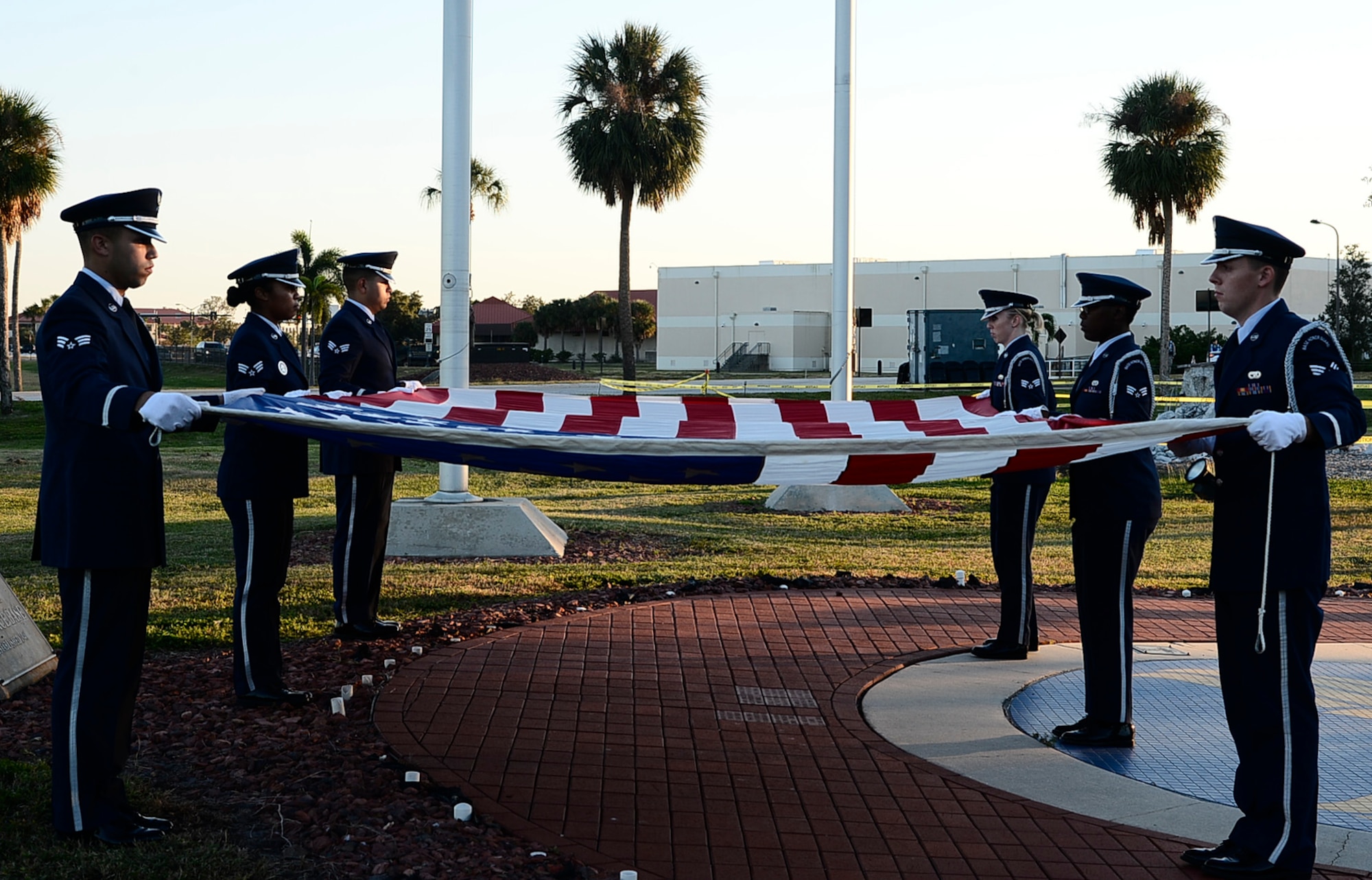 Members from MacDill Air Force Base, Fla., honor guard prepare to fold a flag during a Veterans Day Ceremony at MacDill Air Force Base, Fla., Nov. 10, 2016. Veterans Day is observed annually on November 11 to honor military veterans who have served in the U.S. Armed Forces. (U.S. Air Force photo by Senior Airman Tori Schulz)