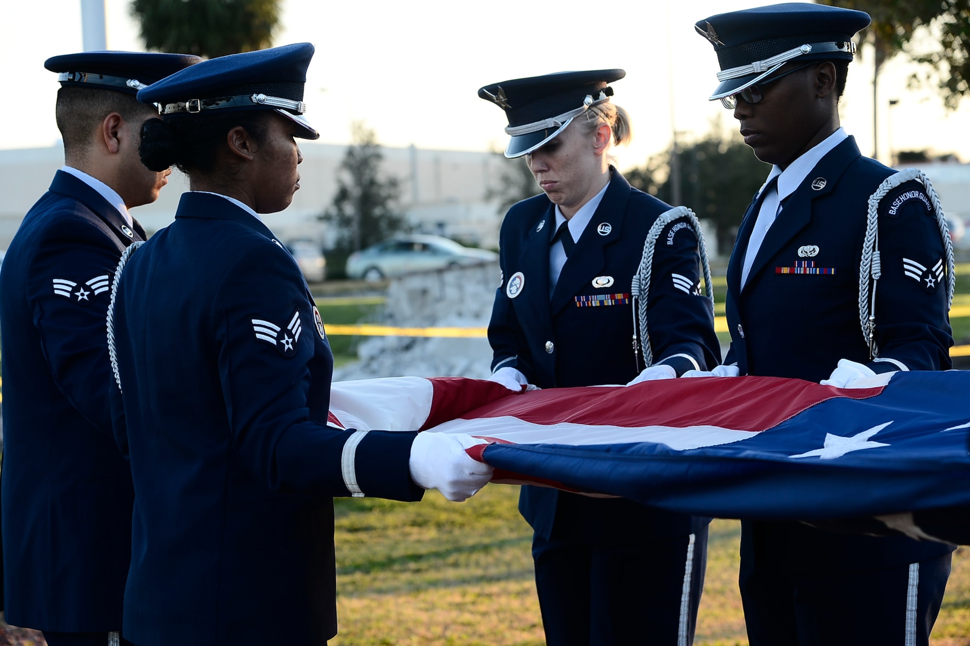 Honor guardsmen with the MacDill Air Force Base honor guard fold a flag during a Veterans Day Ceremony at MacDill Air Force Base, Fla., Nov. 10, 2016. MacDill honored Veterans Day with a ceremony consisting of opening remarks by Col. Patrick Miller, commander of the 6th Mission Support Group, a flag fold and retreat ceremony. (U.S. Air Force photo by Senior Airman Tori Schultz)