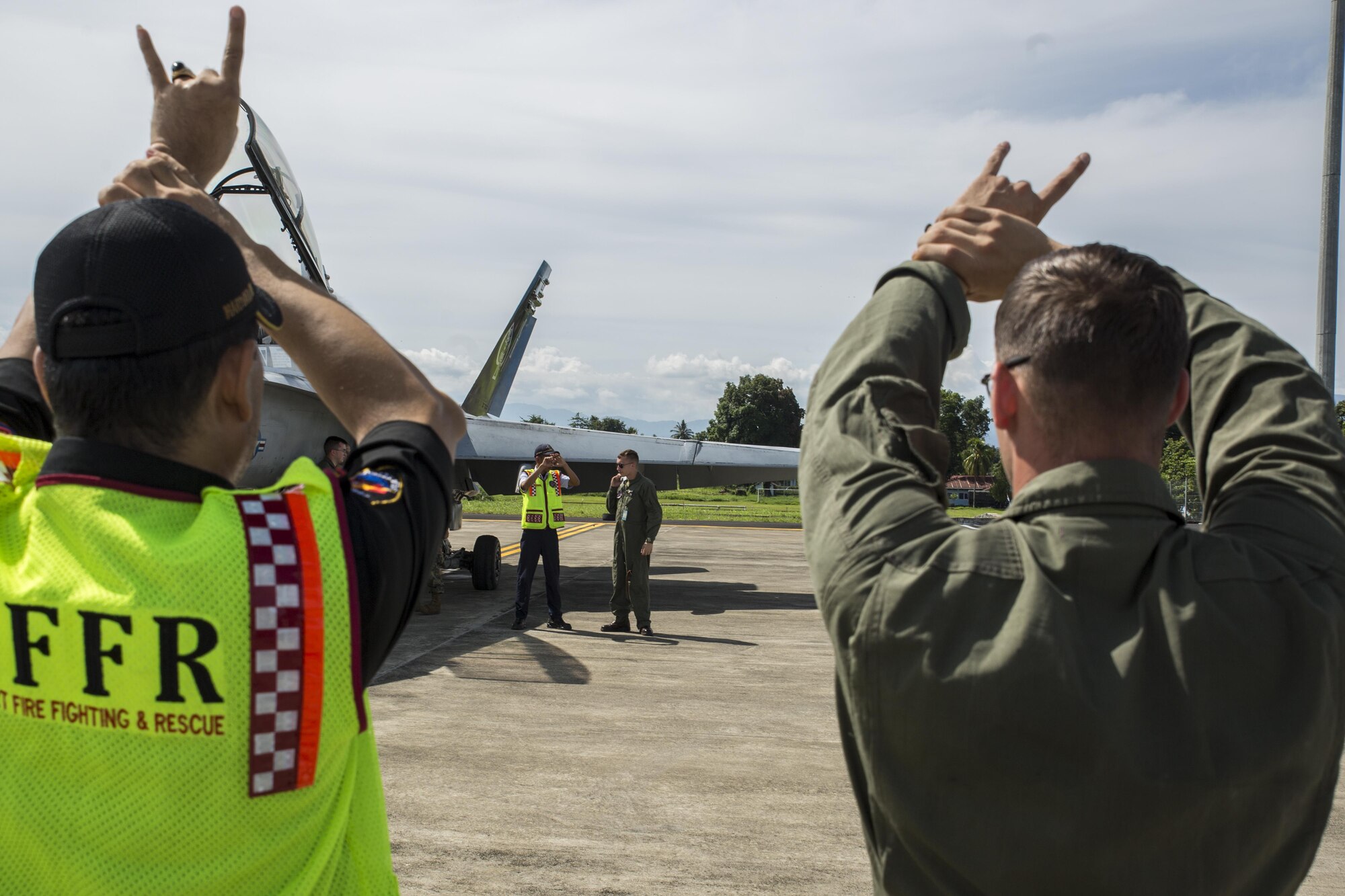 Expeditionary Fire Rescue Marines with Wing Support Squadron (MWSS) 171, teach rescue procedures to Indonesian Aircraft Rescue and Firefighting personnel during exercise Cope West 17 at Sam Ratulangi International Airport, Indonesia, Nov. 3, 2016. Marine All-Weather Fighter Attack Squadron (VMFA (AW)) 225 is participating in exercise Cope West 17, the first fighter-focused exercise in 19 years involving the U.S. Marine Corps and Indonesian Air Force. The squadron plans to complete their unit air-to-air training requirements, which focuses on basic fighter maneuvering, section engaged maneuvering, offensive anti-air warfare and active air defense versus the Indonesian Air Force to increase situational readiness, interoperability, knowledge and partnership between the U.S. and Indonesia. (U.S. Marine Corps photo by Cpl. Aaron Henson)
