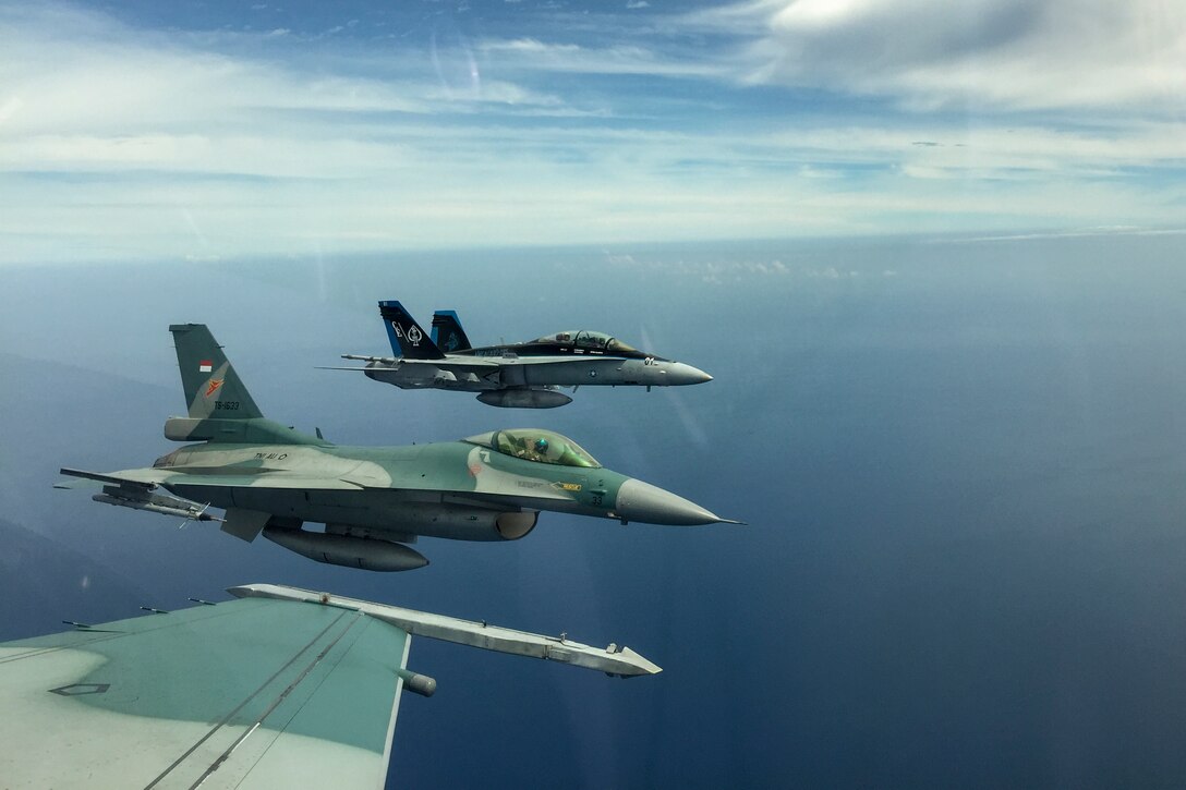 A U.S. Marine Corps F/A-18D Hornet with Marine All-Weather Fighter Attack Squadron (VMFA (AW)) 225 and two Indonesian Air Force F-16 Fighting Falcons fly in formation during exercise Cope West 17 in Indonesia, Nov. 4, 2016. This fighter-focused, bilateral exercise between the U.S. Marine Corps and Indonesian Air Force is designed to enhance the readiness of combined interoperability between the two nations. Both the U.S. F/A-18D Hornets and Indonesian F-16 Fighting Falcons bring unique capabilities affording the associated countries the opportunity to learn and understand each other’s skills, preparing them for real world contingencies and further strengthening their relationship. (Courtesy photo by TNI-AU Capt. I Gede Ngurah Satrya Wibawa)