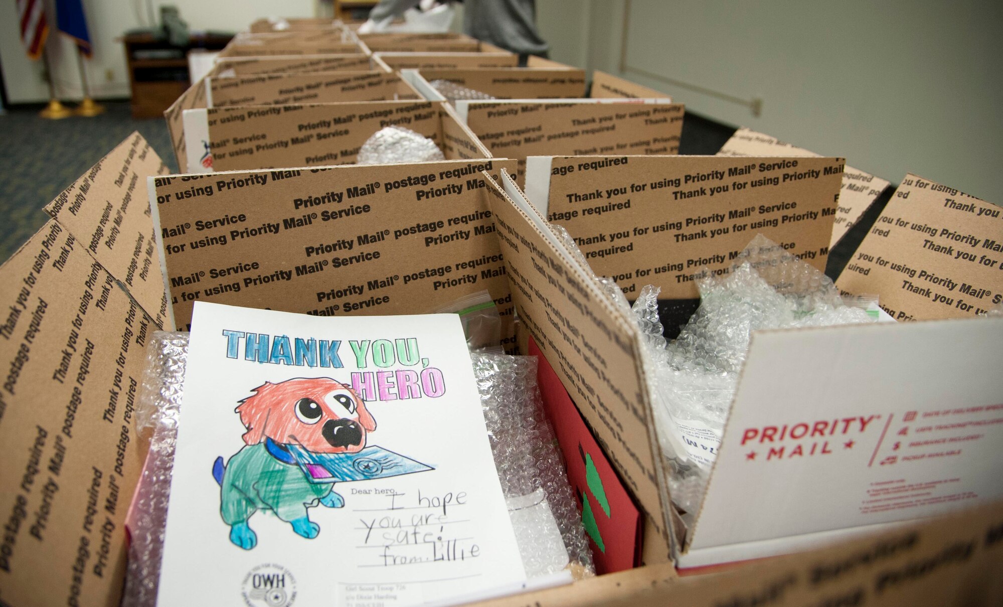 More than 1,600 holiday cookies, candy and greetings from local elementary school students were packed up and mailed to 23 deployed or remotely assigned Airmen Nov. 10 during Operation Cookie Cutter at Vance Air Force Base, Oklahoma. (U.S. Air Force photo/ Tech. Sgt. Nancy Falcon)
