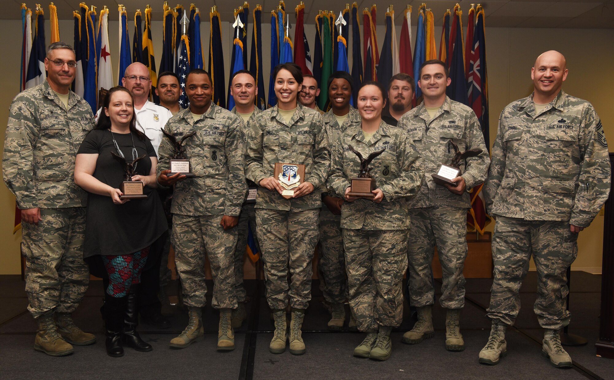 Col. Stephen Kravitsky, 90th Missile Wing commander and Chief Master Sgt. Jeffery Steagall, 90th MW command chief, pose with the wing’s third quarter award winners Nov. 10, 2016, at F.E. Warren Air Force Base, Wyo. The wing holds a ceremony each quarter for all the nominees and presents awards to the winners. (U.S. Air Force photo by Airman 1st Class Breanna Carter)