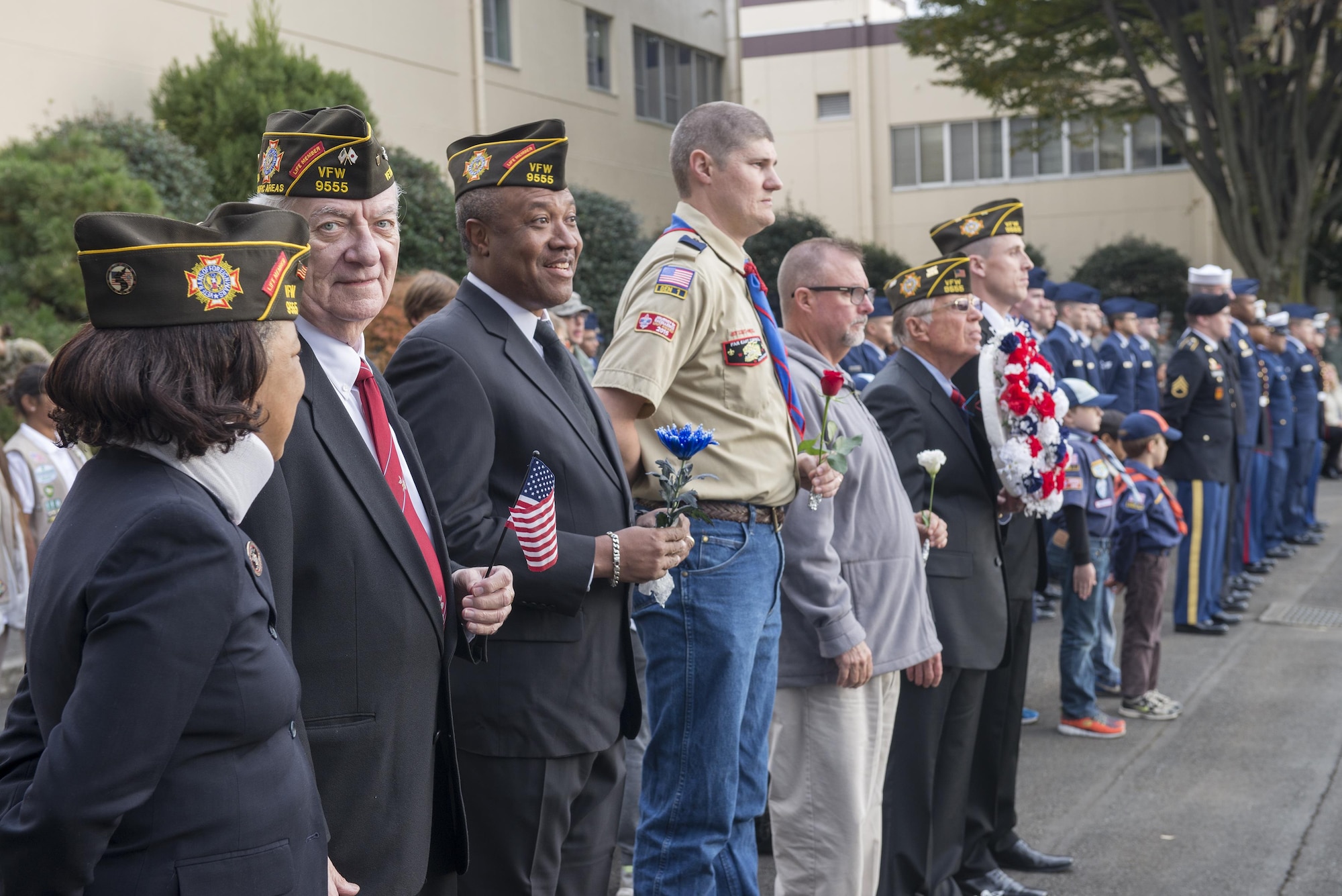 Members of Team Yokota take part in a Veterans Day ceremony at Yokota Air Base, Japan, Nov. 10, 2016. Veterans day celebrates the service of all U.S. military veterans and coincides with Armistice Day and Remembrance Day which are celebrated in other countries, marking the anniversary of the end of World War I. (U.S. Air Force graphic by Senior Airman David C. Danford/Released)
