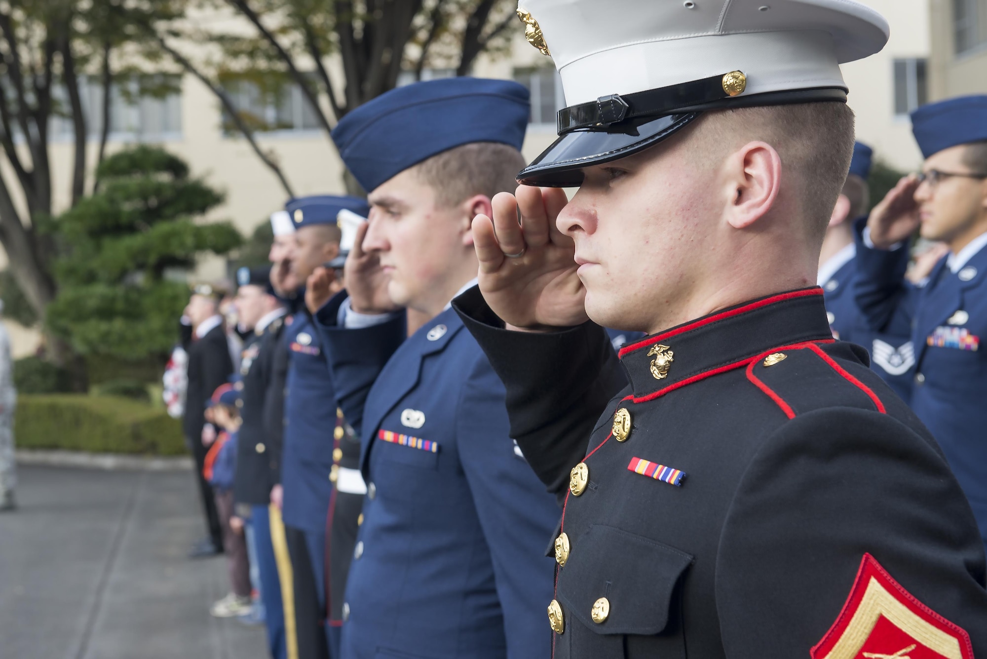 Service members render a salute during a Veterans Day ceremony at Yokota Air Base, Japan, Nov. 10, 2016. Veterans day celebrates the service of all U.S. military veterans and coincides with Armistice Day and Remembrance Day which are celebrated in other countries, marking the anniversary of the end of World War I. (U.S. Air Force photo by Senior Airman David C. Danford/Released)