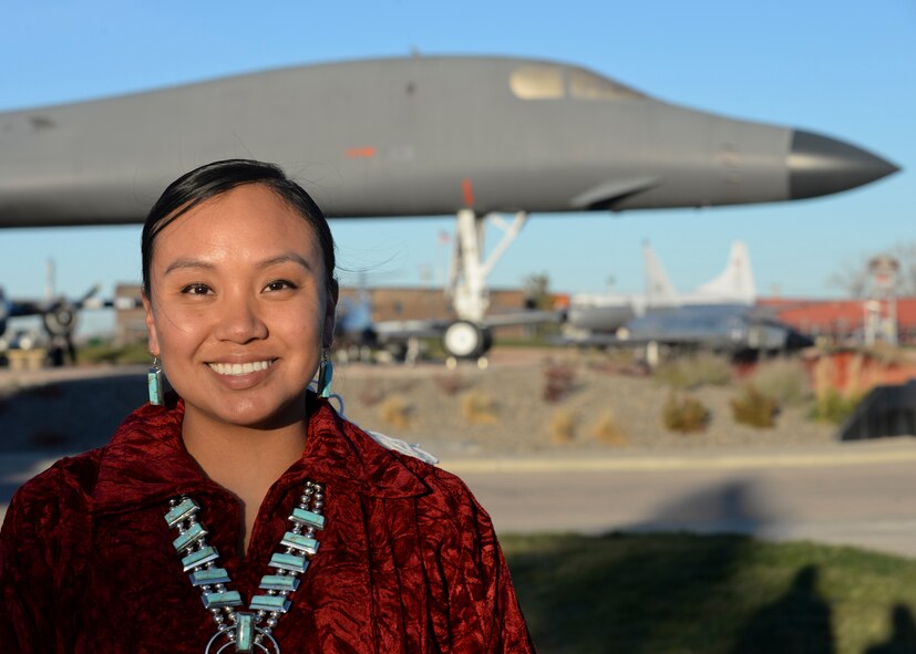 Staff Sgt. Anika Dexter, an individual protective equipment supervisor assigned to the 28th Logistics Readiness Squadron, poses for a photo in front of a B-1B Lancer at the South Dakota Air & Space Museum Nov. 10, 2016 at Ellsworth Air Force Base, S.D. Dexter, a Navajo Native American, is proud to honor her traditions and serve in the military defending her country, following in the same footsteps as her grandfathers. (U.S. Air Force photo by Senior Airman Anania Tekurio)