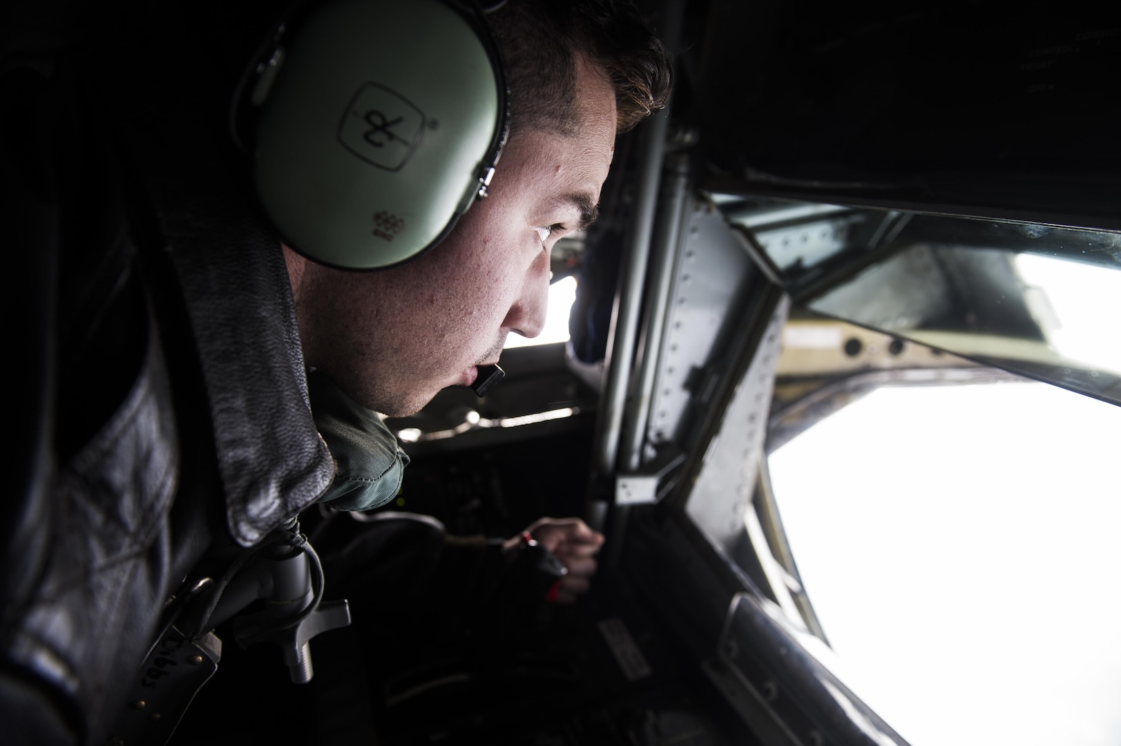 Staff Sgt. Nick Eykamp, boom operator, 92nd Aerial Refueling Squadron, Fairchild Air Force Base, Wa., waits to begin refueling aircraft in a the boom pod of a KC-135 stratotanker after takeoff in support of Vigilant Shield 2017 Field Training Exercise 17 Oct., 2016,at Joint Base Elmendorf-Richardson, Alaska. 