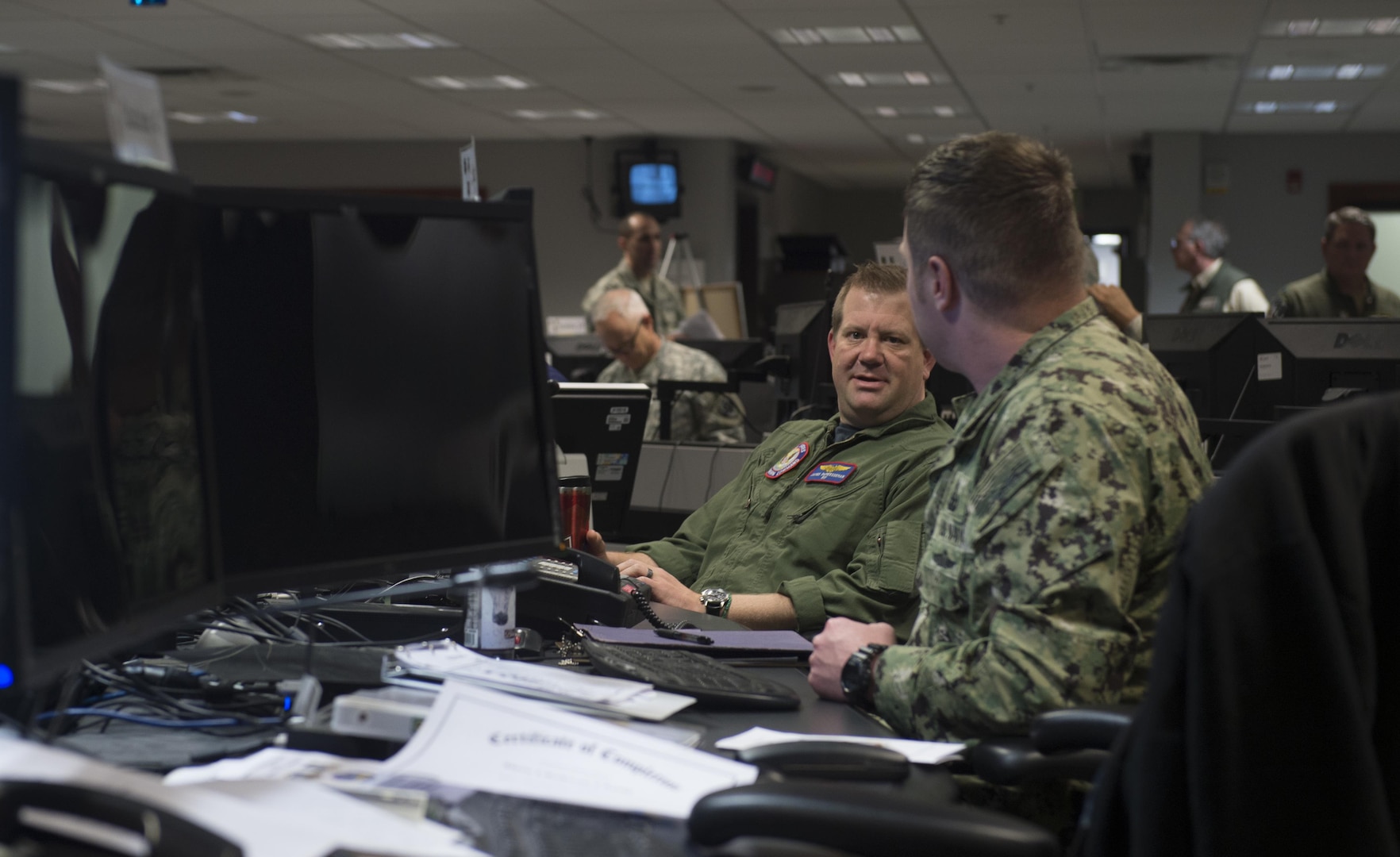 U.S. and Canadian armed forces Service members participating in The Vigilant Shield 2017 Field Training Exercise work in the joint operations center at headquarters Alaskan Command at Joint Base Elmendorf-Richardson, Alaska, 16 Oct., 2016. 