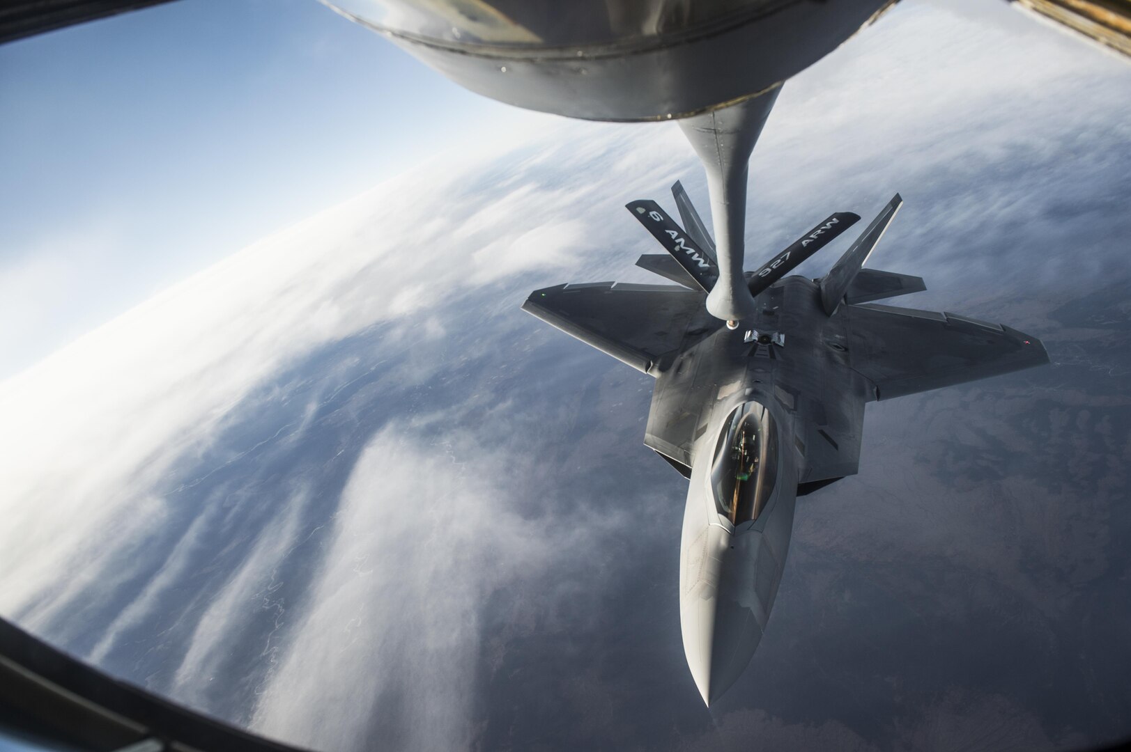 U.S. Air Force F-22 Raptors from Joint Base Elmendorf-Richardson, Alaska, receive fuel from a KC-135 Stratotanker flown by the 92nd Aerial Refueling Squadron from Fairchild Air Force Base, Wa., while both units participate in the Vigilant Shield 2017 Field Training Exercise 17 Oct., 2016, in the high arctic. 
(U.S. Air Force Photo by Tech. Sgt. Gregory Brook)