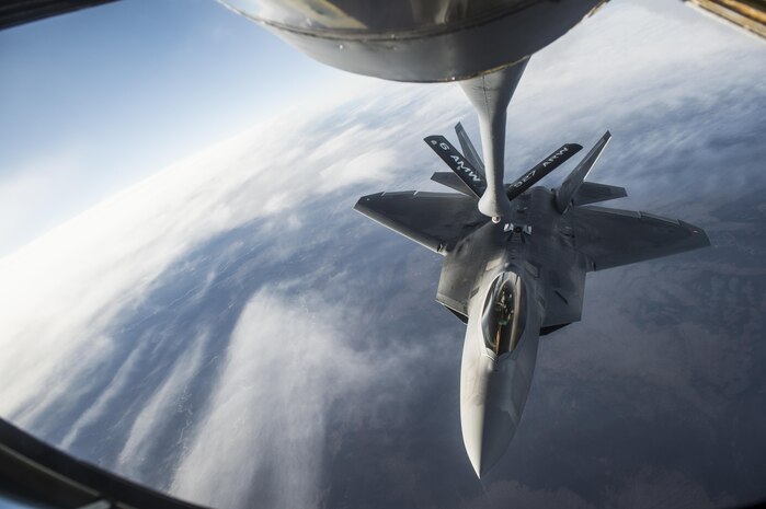 U.S. Air Force F-22 Raptors from Joint Base Elmendorf-Richardson, Alaska, receive fuel from a KC-135 Stratotanker flown by the 92nd Aerial Refueling Squadron from Fairchild Air Force Base, Wa., while both units participate in the Vigilant Shield 2017 Field Training Exercise 17 Oct., 2016, in the high arctic. 
(U.S. Air Force Photo by Tech. Sgt. Gregory Brook)
