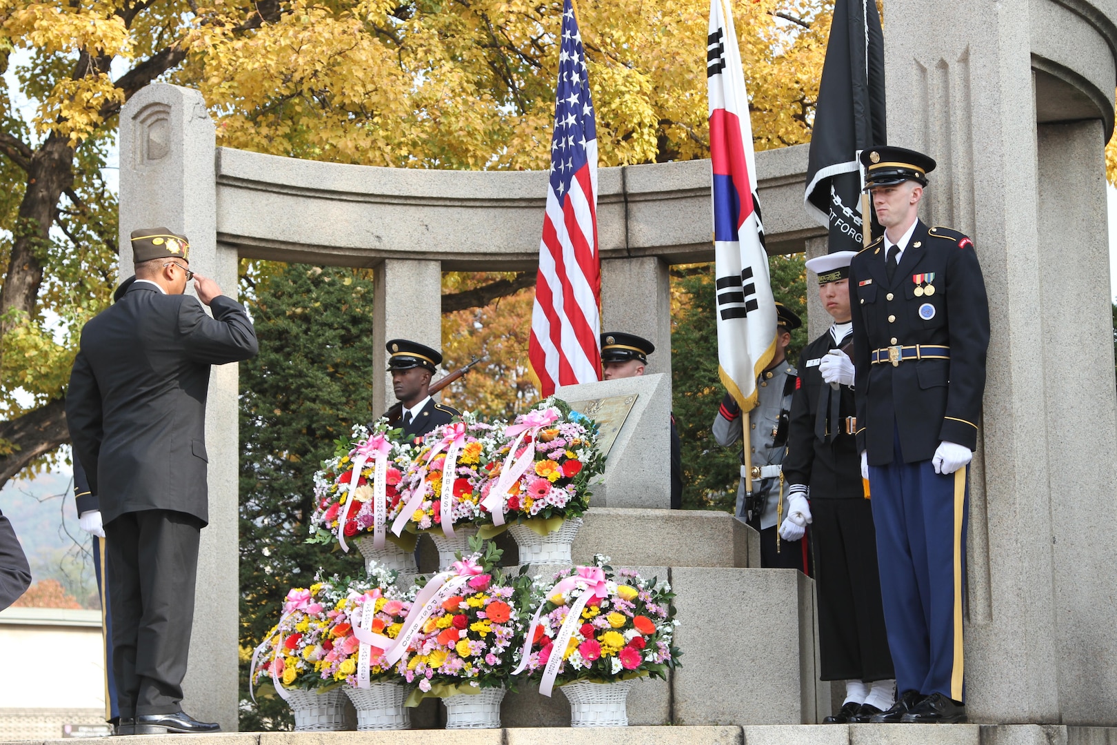A war veteran from the Veterans of Foreign Wars salutes and pays respect to war veterans for their service during the Veterans Day ceremony at the Eighth Army Memorial, Yongsan, Republic of Korea, Nov. 11, 2016.
