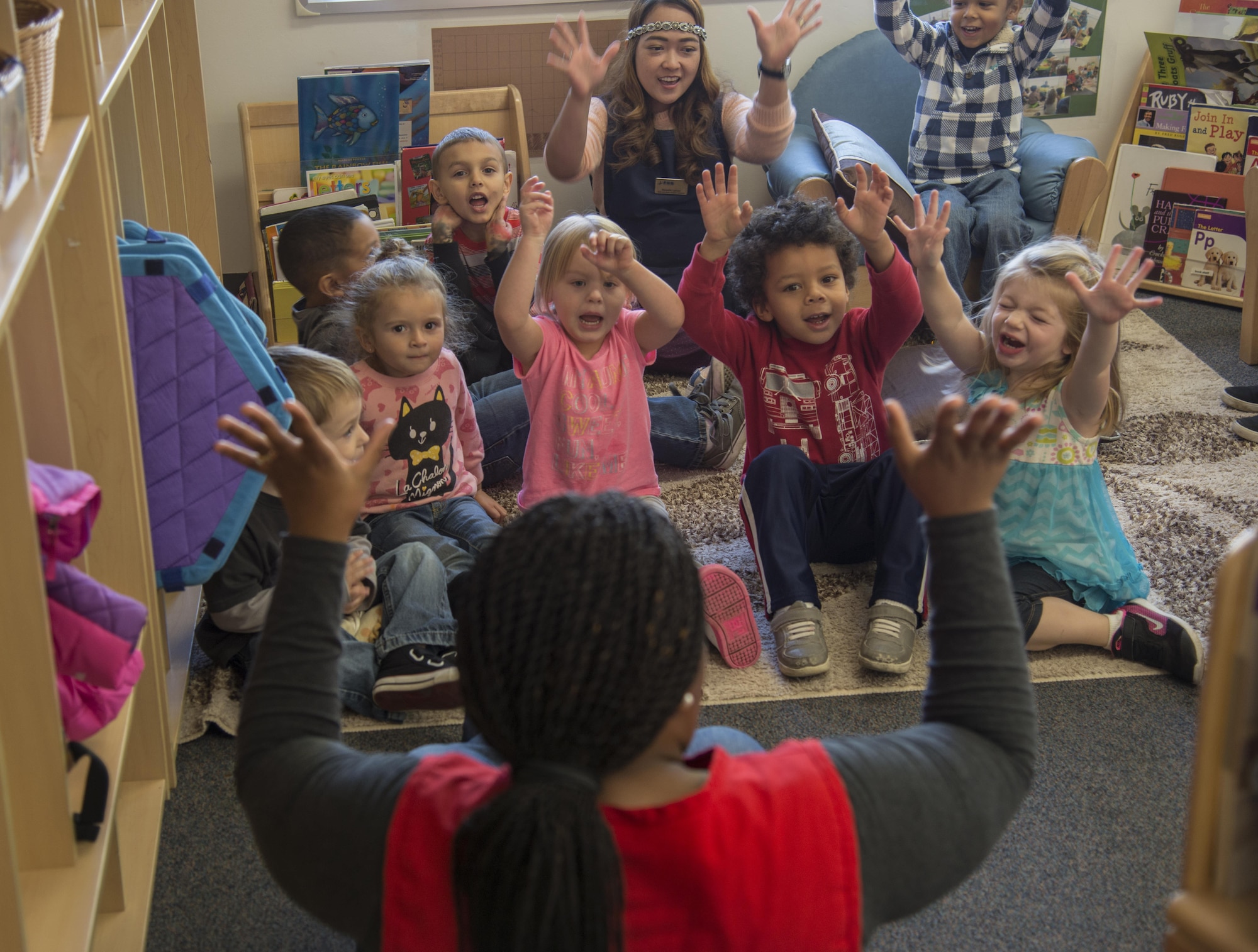 Children sing “Happy and you know it” in the 35th Force Support Squadron Yoiko Child Development Center at Misawa Air Base, Japan, Nov. 2, 2016. These children are part of a preschool age classroom, which teaches them gross motor skills, enhances their social abilities, builds their self-help abilities and teaches other important skills. (U.S. Air Force photo by Senior Airman Brittany A. Chase)