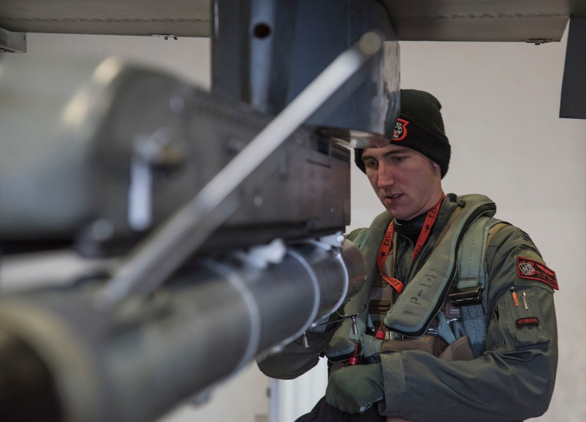 U.S. Air Force Capt. Kyle Benham, a 13th Fighter Squadron F-16 Fighting Falcon pilot, loads a tape into an air combat maneuvering instrument, prior to taking flight during exercise Keen Sword 17 at Misawa Air Base, Japan, Nov. 10, 2016. The 35th Fighter Wing focused on combat readiness and partnered with the VAQ-135 Naval Unit and the Japan Air Self-Defense Forces to work on joint tactics to practice a defensive counter-air scenarios. (U.S. Air Force photo by Airman 1st Class Sadie Colbert)