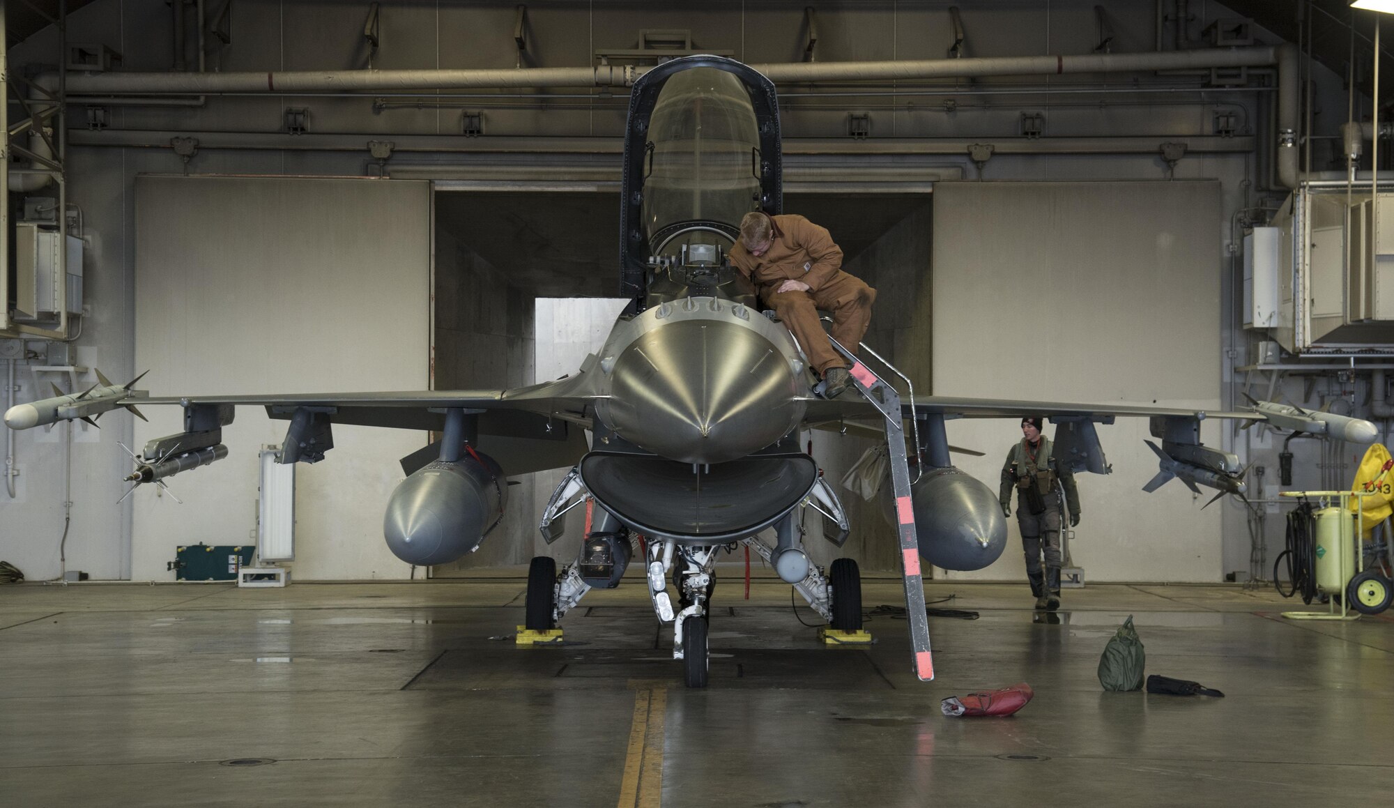 U.S. Air Force Airman 1st Class Patrick O'Connell, left, a 35th Maintenance Squadron crew chief and Capt. Kyle Benham, right, a 35th Fighter Wing F-16 Fighting Falcon pilot, performs a pre-flight check during exercise Keen Sword 17 at Misawa Air Base, Japan, Nov. 10, 2016. Misawa participated in a series of bilateral exercises, showcasing the positive relationship with our Japanese host nation. (U.S. Air Force photo by Airman 1st Class Sadie Colbert)