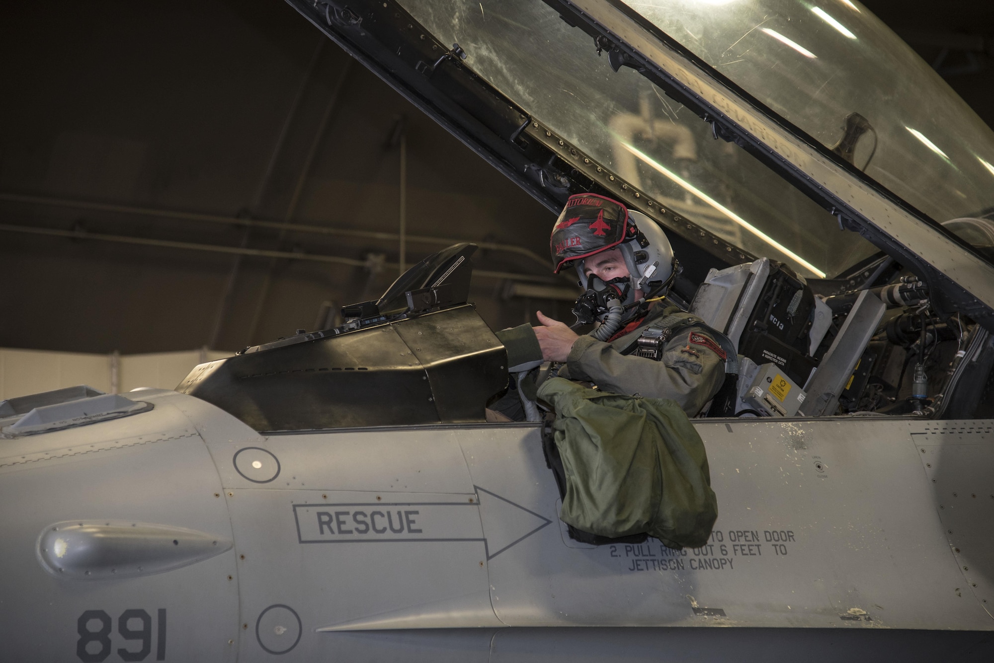 U.S. Air Force Capt. Kyle Benham, a 35th Fighter Wing F-16 Fighting Falcon pilot, dons his piloting gloves before flight during bilateral exercise Keen Sword 17, at Misawa Air Base, Japan, Nov. 10, 2016. The exercise had various scenarios, including defending the Hokkaido Port, in Hokkaido, Japan, from a multitude of enemies. The U.S. has maintained a diplomatic, economic, and military presence in the Pacific throughout our nation's history. (U.S. Air Force photo by Airman 1st Class Sadie Colbert)