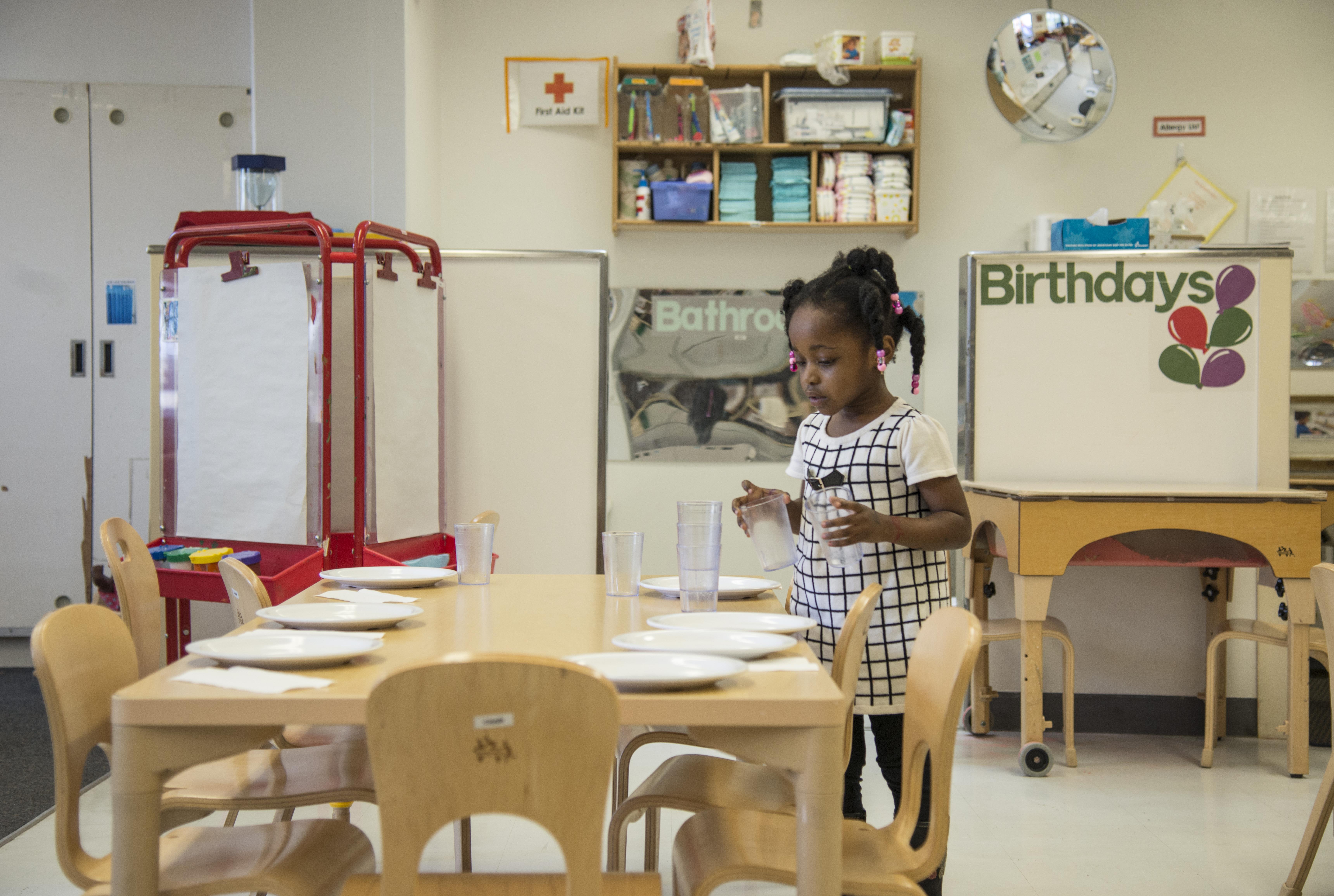 Child Setting The Table