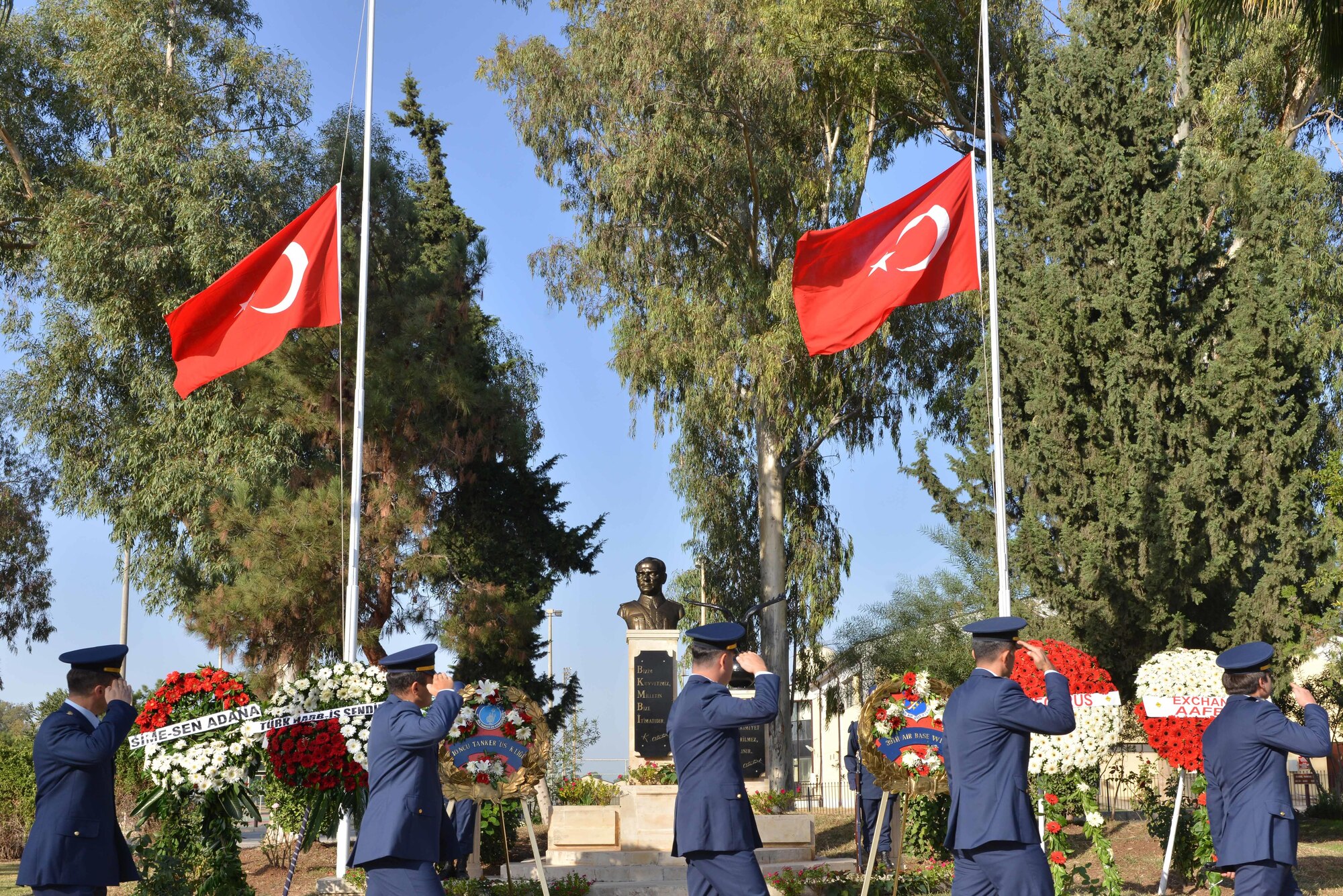 Turkish Air Force members assigned to the 10th Tanker Base salute as they pass a statue of Mustafa Kemal Ataturk during a memorial ceremony Nov. 10, 2016, at Incirlik Air Base, Turkey. Mustafa Kemal, in recognition of his efforts, was given the last name ‘Ataturk’, which means ‘father of Turks’. (U.S. Air Force photo by Senior Airman John Nieves Camacho)