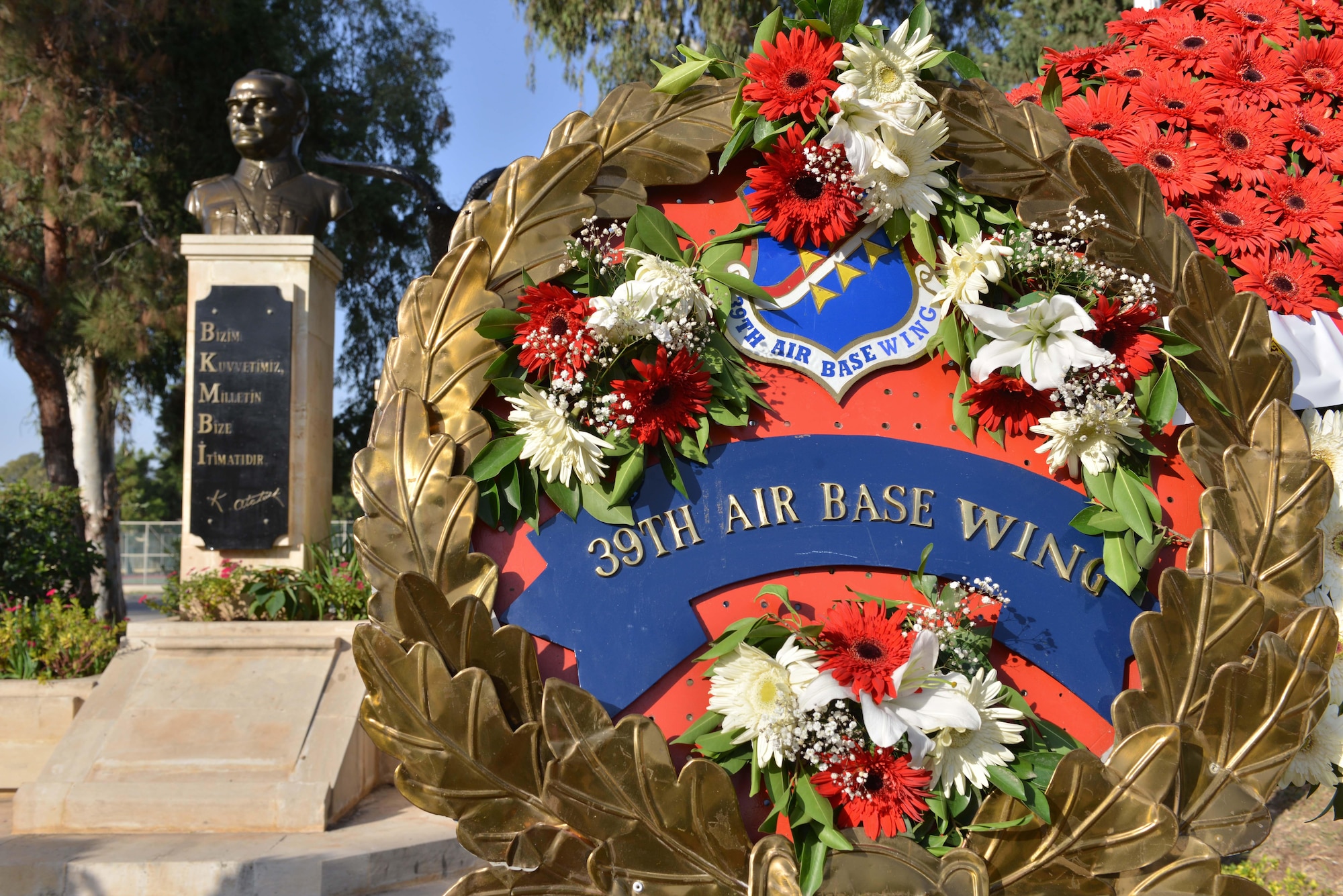 A wreath offered by 39th Air Base Wing personnel sits by a memorial statue of Mustafa Kemal Ataturk Nov. 10, 2016, at Incirlik Air Base, Turkey. Wreaths were offered by 10th Tanker Base partners and displayed by Ataturk's statue. (U.S. Air Force photo by Senior Airman John Nieves Camacho)