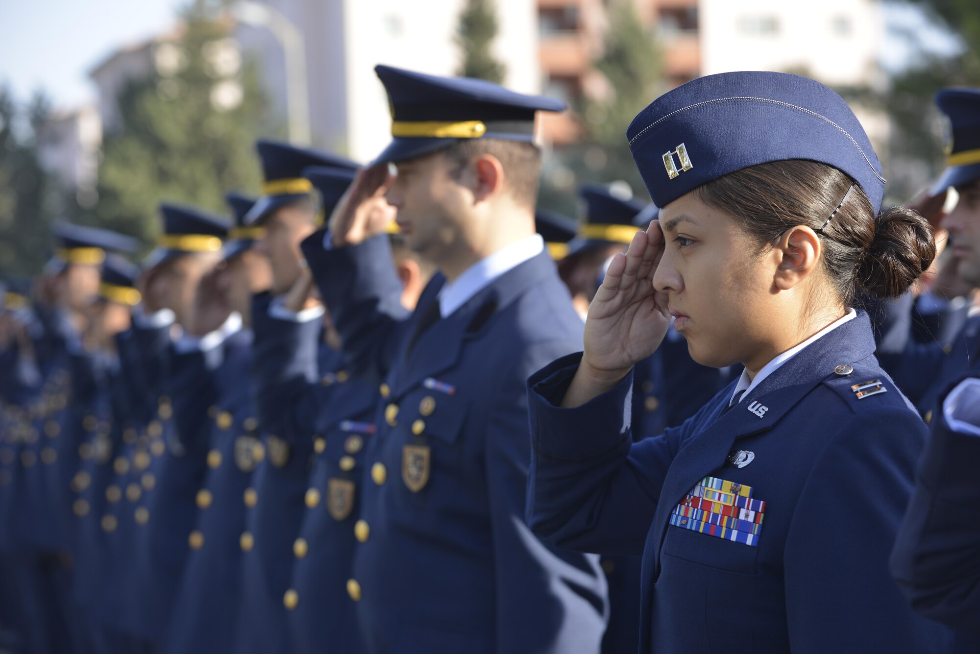 U.S. Air Force Capt. Claire Carlos, 39th Air Base Wing sexual assault response coordinator, along with 10th Tanker Base personnel, salute during a memorial ceremony for Mustafa Kemal Ataturk Nov. 10, 2016, at Incirlik Air Base, Turkey. U.S. and Turkish service members gathered to pay respect and honor Ataturk. (U.S. Air Force photo by Senior Airman John Nieves Camacho)